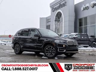 <b>Sunroof,  Leather Seats,  Heated Seats,  Apple CarPlay,  Navigation!</b><br> <br> Welcome to Crowfoot Dodge, Calgarys New and Pre-owned Superstore proudly serving Albertans for 44 years!<br> <br> Compare at $29995 - Our Price is just $27995! <br> <br>   This 2018 BMW SUV remains as the same thoughtful family oriented SUV it was designed to be. It offers loads of room, premium comfort and top notch mechanical refinement. This  2018 BMW X5 is fresh on our lot in Calgary. <br> <br>One of the best premium SUVs in the world with an impeccable long standing history comes back again better than ever. This 2018 BMW X5 offers a subtly stylish design, excellent on road stability and a smooth and refined ride quality. While subtlety is a high point on the outside styling, the lavish interior with ornate high quality elements paired to the high cargo carrying capacity make this X5 an excellent two for one deal. This  SUV has 116,791 kms. Stock number 248800A is black in colour  . It has a 8 speed automatic transmission and is powered by a  smooth engine.   <br> <br> Our X5s trim level is xDrive35i. Well equipped with superior levels of comfort, this BMW X5 xDrive35i is standard fitted with aluminum alloy wheels, a power tailgate, front fog lamps, dual power sunroofs, a powerful sound system with Bluetooth connectivity and 20 GB of internal memory, voice activated and controlled navigation, a heated sport leather steering wheel, heated front seats, push button start, remote keyless entry, Dakota leather upholstery, dual zone climate control, cruise control, power anti whiplash front head restraints, front and rear parking sensors and a rear view camera. This vehicle has been upgraded with the following features: Sunroof,  Leather Seats,  Heated Seats,  Apple Carplay,  Navigation,  Hud,  Power Liftgate. <br> <br/><br> Buy this vehicle now for the lowest bi-weekly payment of <b>$201.05</b> with $0 down for 84 months @ 7.99% APR O.A.C. ( Plus GST      / Total Obligation of $36592  ).  See dealer for details. <br> <br>At Crowfoot Dodge, we offer:<br>
<ul>
<li>Over 500 New vehicles available and 100 Pre-Owned vehicles in stock...PLUS fresh trades arriving daily!</li>
<li>Financing and leasing arrangements with rates from prime +0%</li>
<li>Same day delivery.</li>
<li>Experienced sales staff with great customer service.</li>
</ul><br><br>
Come VISIT us today!<br><br> Come by and check out our fleet of 80+ used cars and trucks and 150+ new cars and trucks for sale in Calgary.  o~o