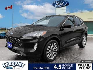 Agate Black Metallic 2022 Ford Escape Titanium 401A 401A 4D Sport Utility EcoBoost 2.0L I4 GTDi DOHC Turbocharged VCT 8-Speed Automatic AWD AWD, 3.47 Axle Ratio, Air Conditioning, Alloy wheels, AM/FM radio: SiriusXM, Auto High-beam Headlights, Compass, Delay-off headlights, Driver door bin, Driver vanity mirror, Equipment Group 401A, Front dual zone A/C, Front fog lights, Fully automatic headlights, Heated steering wheel, Low tire pressure warning, Passenger door bin, Passenger vanity mirror, Power driver seat, Power steering, Power windows, Rear window defroster, Rear window wiper, Remote keyless entry, Steering wheel mounted audio controls, Telescoping steering wheel, Tilt steering wheel, Variably intermittent wipers.