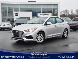 New Price! Olympus Silver 2018 Hyundai Accent GL Apple Carplay | Android Auto | Auto | One Owner | FWD 6-Speed Automatic I4 Bridgewater Volkswagen, Located in Bridgewater Nova Scotia.Black Cloth, 6 Speakers, ABS brakes, Air Conditioning, Alloy wheels, AM/FM radio: SiriusXM, Anti-whiplash front head restraints, AppLink/Apple CarPlay and Android Auto, Brake assist, Bumpers: body-colour, Cloth Seating Surfaces, Driver door bin, Driver vanity mirror, Dual front impact airbags, Dual front side impact airbags, Electronic Stability Control, Exterior Parking Camera Rear, Front anti-roll bar, Front Bucket Seats, Front reading lights, Front wheel independent suspension, Heated door mirrors, Heated Front Bucket Seats, Heated front seats, Illuminated entry, Occupant sensing airbag, Outside temperature display, Overhead airbag, Overhead console, Panic alarm, Passenger door bin, Passenger vanity mirror, Power door mirrors, Power steering, Power windows, Radio: AM/FM/SiriusXM Audio System, Rear window defroster, Remote keyless entry, Security system, Speed control, Speed-sensing steering, Split folding rear seat, Steering wheel mounted audio controls, Tachometer, Telescoping steering wheel, Tilt steering wheel, Traction control, Trip computer, Variably intermittent wipers.Certification Program Details: 150 Points Inspection Fresh Oil Change Free Carfax Full Detail 2 years MVI Full Tank of Gas The 150+ point inspection includes: Engine Instrumentation Interior components Pre-test drive inspections The test drive Service bay inspection Appearance Final inspection