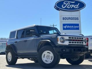 <b>Navigation, 17 inch Aluminum Wheels, Remote Engine Start!</b><br> <br> <br> <br>  Not only is this 2024 Ford Bronco a cool and capable off-roader, but its also incredibly satisfying to drive every day. <br> <br>With a nostalgia-inducing design along with remarkable on-road driving manners with supreme off-road capability, this 2024 Ford Bronco is indeed a jack of all trades and masters every one of them. Durable build materials and functional engineering coupled with modern day infotainment and driver assistive features ensure that this iconic vehicle takes on whatever you can throw at it. Want an SUV that can genuinely do it all and look good while at it? Look no further than this 2024 Ford Bronco!<br> <br> This azure gray metallic tricoat SUV  has a 10 speed automatic transmission and is powered by a  315HP 2.7L V6 Cylinder Engine.<br> <br> Our Broncos trim level is Heritage Edition. This Bronco Heritage features unique exterior styling, unique aluminum wheels with a full-size spare, heated seats, dual-zone climate control, front fog lamps and a leather-wrapped steering wheel, in addition to fantastic standard features such as off-roading suspension, a comprehensive terrain management system with switchable drive modes, a manual targa composite 1st row sunroof, a manual convertible hard top with fixed rollover protection, a flip-up rear window, LED headlights with automatic high beams, and proximity keyless entry with push button start. Connectivity is handled by an 8-inch LCD screen powered by SYNC 4 with inbuilt navigation, wireless Apple CarPlay and Android Auto, with SiriusXM satellite radio. Additional features include towing equipment including trailer sway control, pre-collision assist with pedestrian detection, lane keeping assist with lane departure warning, forward collision mitigation, a rearview camera, and even more. This vehicle has been upgraded with the following features: Navigation, 17 Inch Aluminum Wheels, Remote Engine Start. <br><br> View the original window sticker for this vehicle with this url <b><a href=http://www.windowsticker.forddirect.com/windowsticker.pdf?vin=1FMEE4DP6RLA01232 target=_blank>http://www.windowsticker.forddirect.com/windowsticker.pdf?vin=1FMEE4DP6RLA01232</a></b>.<br> <br>To apply right now for financing use this link : <a href=https://www.bourgeoismotors.com/credit-application/ target=_blank>https://www.bourgeoismotors.com/credit-application/</a><br><br> <br/> 7.99% financing for 84 months.  Incentives expire 2024-05-23.  See dealer for details. <br> <br>Discount on vehicle represents the Cash Purchase discount applicable and is inclusive of all non-stackable and stackable cash purchase discounts from Ford of Canada and Bourgeois Motors Ford and is offered in lieu of sub-vented lease or finance rates. To get details on current discounts applicable to this and other vehicles in our inventory for Lease and Finance customer, see a member of our team. </br></br>Discover a pressure-free buying experience at Bourgeois Motors Ford in Midland, Ontario, where integrity and family values drive our 78-year legacy. As a trusted, family-owned and operated dealership, we prioritize your comfort and satisfaction above all else. Our no pressure showroom is lead by a team who is passionate about understanding your needs and preferences. Located on the shores of Georgian Bay, our dealership offers more than just vehiclesits an experience rooted in community, trust and transparency. Trust us to provide personalized service, a diverse range of quality new Ford vehicles, and a seamless journey to finding your perfect car. Join our family at Bourgeois Motors Ford and let us redefine the way you shop for your next vehicle.<br> Come by and check out our fleet of 80+ used cars and trucks and 190+ new cars and trucks for sale in Midland.  o~o