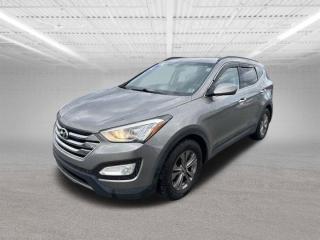 The 2015 Hyundai Santa Fe Sport 2.0T Premium is a midsize SUV that offers a blend of performance, comfort, and features. Heres an overview of this vehicle:Engine: The Santa Fe Sport 2.0T Premium is powered by a turbocharged 2.0-liter four-cylinder engine, producing around 264 horsepower and 269 lb-ft of torque. This engine provides strong acceleration and towing capability compared to the non-turbocharged version.Transmission: It comes paired with a six-speed automatic transmission, delivering smooth shifts and responsive performance.Fuel Economy: The 2.0T engine sacrifices a bit of fuel efficiency compared to the base 2.4-liter engine but still offers respectable mileage. Expect EPA-estimated fuel economy figures of around 18-20 mpg in the city and 24-27 mpg on the highway, depending on the drivetrain (front-wheel drive or all-wheel drive).Interior: The Santa Fe Sports cabin is spacious and well-appointed, with comfortable seating for up to five passengers. The Premium trim typically includes features like leather upholstery, heated front seats, a panoramic sunroof, dual-zone automatic climate control, and a touchscreen infotainment system with Bluetooth connectivity.Cargo and Space: The Santa Fe Sport offers versatile cargo space, with a split-folding rear seat that expands the cargo area when needed. The overall interior design emphasizes practicality and comfort.Safety: Hyundai equipped the Santa Fe Sport with a range of safety features, including antilock brakes, stability control, traction control, and a suite of airbags. Higher trim levels may include advanced safety technologies such as blind-spot monitoring and rear cross-traffic alert.Driving Experience: The 2.0T engine delivers strong performance, making the Santa Fe Sport feel responsive and capable, especially for highway driving and passing maneuvers. The SUVs suspension strikes a good balance between comfort and handling, offering a smooth ride over various road surfaces.Trim Levels: The 2015 Santa Fe Sport lineup includes different trim levels, with the 2.0T Premium sitting near the top of the range. Other trims may offer additional features or different powertrain options.Overall Impression: The 2015 Hyundai Santa Fe Sport 2.0T Premium is a well-rounded SUV that appeals to those seeking a comfortable and capable vehicle for daily commuting and family outings. The turbocharged engine provides ample power, while the interior offers plenty of amenities and space for passengers and cargo.