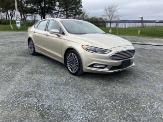 The 2018 Ford Fusion Titanium embodies a harmonious blend of style, performance, and technology, making it a standout choice in the midsize sedan segment. From its sleek exterior design to its refined interior, the Fusion Titanium exudes an air of sophistication that appeals to discerning drivers.At first glance, the Fusion Titanium captivates with its sleek and aerodynamic profile, featuring distinctive lines and a bold front grille that commands attention on the road. The attention to detail in the exterior design reflects Fords commitment to both aesthetics and functionality, resulting in a car that not only looks great but also performs exceptionally well in terms of fuel efficiency and handling.Inside the cabin, the Fusion Titanium offers a luxurious and comfortable environment that rivals more expensive luxury sedans. High-quality materials and thoughtful design elements create an inviting space for both driver and passengers, while advanced features such as heated and cooled front seats, a premium audio system, and Fords intuitive SYNC 3 infotainment system elevate the driving experience to new heights.Under the hood, the Fusion Titanium delivers impressive performance thanks to its available turbocharged engine options. Whether cruising on the highway or navigating city streets, the Fusion Titanium offers responsive acceleration and smooth handling, making every drive a pleasure.In addition to its performance and comfort, the Fusion Titanium also prioritizes safety, with a host of advanced driver-assistance features available to help prevent accidents and protect occupants. From adaptive cruise control to lane-keeping assist, the Fusion Titanium provides peace of mind on the road.Overall, the 2018 Ford Fusion Titanium stands out as a compelling choice in the midsize sedan market, offering a winning combination of style, performance, technology, and safety. Whether youre commuting to work or embarking on a weekend getaway, the Fusion Titanium delivers a premium driving experience that is sure to impress.