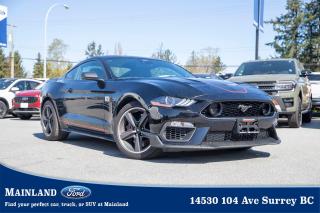 <p><strong><span style=font-family:Arial; font-size:18px;>Let the adventure begin with a visit to Mainland Ford, where youll find the perfect car for your needs! Our treasure trove boasts the 2021 Ford Mustang Mach 1 Coupe, a vehicle that doesnt just offer a ride, but an experience..</span></strong></p> <p><strong><span style=font-family:Arial; font-size:18px;>This gem is waiting for you, untouched, untamed, and unridden..</span></strong> <br> Yes, its used but with zero kilometers on it, this Mustang is practically a wild horse waiting for its first ride.. Buckle up and feel the raw power of the 5.0L 8-cylinder engine paired with a 6-speed manual transmission.</p> <p><strong><span style=font-family:Arial; font-size:18px;>This beauty roars to life, encapsulating the spirit of freedom and excitement that the Mustang is known for..</span></strong> <br> The sport suspension and adaptive suspension ensure every drive is smooth, comfortable, and thrilling, whether youre navigating city streets or hitting the open road.. The Mach 1s exterior is a masterpiece, arrayed in alloy wheels and a spoiler that doesnt just look good, but improves aerodynamics.</p> <p><strong><span style=font-family:Arial; font-size:18px;>The power door mirrors, heated for those frosty mornings, are a subtle yet convenient feature..</span></strong> <br> The automatic high-beam headlights and rain-sensing wipers adapt to your surroundings, ensuring visibility is never compromised.. Step inside and be greeted by the illuminated entry that sets the stage for the opulence within.</p> <p><strong><span style=font-family:Arial; font-size:18px;>The dual-zone A/C, power driver seat with 2-way lumbar support, and front center armrest ensure utmost comfort..</span></strong> <br> The overhead console and remote keyless entry embody the convenience we strive for in modern drives.. Its not all utility, though.</p> <p><strong><span style=font-family:Arial; font-size:18px;>The pin stripe and auto-dimming rearview mirror add a touch of luxury to this powerful beast..</span></strong> <br> Safety is paramount, and the Mustang Mach 1 delivers with ABS brakes, traction control, and an array of airbags.. The security system and panic alarm give you peace of mind, while the rear parking camera makes maneuvering a breeze.</p> <p><strong><span style=font-family:Arial; font-size:18px;>Now, heres a funny tidbit for you..</span></strong> <br> The Mustang Mach 1 has such a comprehensive list of features that one customer jokingly asked if it could make coffee too.. We had a good laugh, but you know what? With the Mustangs trip computer and radio data system, you just might find a nearby café faster!

At Mainland Ford, we speak your language! We understand your needs, desires, and we go above and beyond to ensure you drive away in the car of your dreams.</p> <p><strong><span style=font-family:Arial; font-size:18px;>Dont just dream it, drive it! Make this barely-tamed Mustang Mach 1 Coupe yours today and let the world hear you roar.</span></strong></p><hr />
<p><br />
<br />
To apply right now for financing use this link:<br />
<a href=https://www.mainlandford.com/credit-application/>https://www.mainlandford.com/credit-application</a><br />
<br />
Looking for a new set of wheels? At Mainland Ford, all of our pre-owned vehicles are Mainland Ford Certified. Every pre-owned vehicle goes through a rigorous 96-point comprehensive safety inspection, mechanical reconditioning, up-to-date service including oil change and professional detailing. If that isnt enough, we also include a complimentary Carfax report, minimum 3-month / 2,500 km Powertrain Warranty and a 30-day no-hassle exchange privilege. Now that is peace of mind. Buy with confidence here at Mainland Ford!<br />
<br />
Book your test drive today! Mainland Ford prides itself on offering the best customer service. We also service all makes and models in our World Class service center. Come down to Mainland Ford, proud member of the Trotman Auto Group, located at 14530 104 Ave in Surrey for a test drive, and discover the difference!<br />
<br />
*** All pre-owned vehicle sales are subject to a $599 documentation fee, $149 Fuel Surcharge, $599 Safety and Convenience Fee and $500 Finance Placement Fee (if applicable) plus applicable taxes. ***<br />
<br />
VSA Dealer# 40139</p>

<p>*All prices plus applicable taxes, applicable environmental recovery charges, documentation of $599 and full tank of fuel surcharge of $76 if a full tank is chosen. <br />Other protection items available that are not included in the above price:<br />Tire & Rim Protection and Key fob insurance starting from $599<br />Service contracts (extended warranties) for coverage up to 7 years and 200,000 kms starting from $599<br />Custom vehicle accessory packages, mudflaps and deflectors, tire and rim packages, lift kits, exhaust kits and tonneau covers, canopies and much more that can be added to your payment at time of purchase<br />Undercoating, rust modules, and full protection packages starting from $199<br />Financing Fee of $500 when applicable<br />Flexible life, disability and critical illness insurances to protect portions of or the entire length of vehicle loan</p>