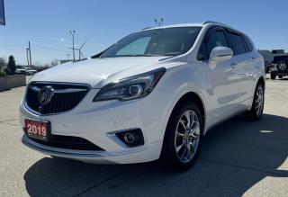 <p style=text-align: center;><strong><span style=font-size: 18pt;>2019 BUICK ENVISION AWD 4DR PREMIUM II</span></strong></p><p style=text-align: center;><strong><span style=font-size: 18pt;>2.0L TURBO DOHC SIDI WITH VVT</span></strong></p><p style=text-align: center;><span style=font-size: 14pt;>252 HORSEPOWER | 295 LB-FT OF TORQUE</span></p><p style=text-align: center;><span style=font-size: 14pt;>9.4L/100KM HIGHWAY | 11.7L/100KM CITY | 10.3L/100KM COMBINED</span></p><p style=text-align: center;><strong><span style=font-size: 18pt;>9-SPEED AUTOMATIC TRANSMISSION</span></strong></p><p style=text-align: center;><strong><span style=font-size: 18pt;>19 10-SPOKE ALUMINUM MACHINE-FACED W/ SILVER PAINTED FINISH</span></strong></p><p style=text-align: center;> </p><p style=text-align: center;><strong><span style=font-size: 14pt;>ENVISION PREMIUM II STANDARD FEATURES</span></strong></p><p style=text-align: center;><span style=font-size: 14pt;><span style=font-size: 18.6667px;>Hands-free Power Liftgate, Keyless Open and Start, Heated Front Seats, Rear Vision Camera, Rear Park Assist, Apple Carplay & Android Auto Compatibility, Heated Steering Wheel, Perforated, Leather-appointed Seating, Heated Rear Outboard Seats, Tri-zone Climate Control, Driver Memory Settings, Lane Change Alert With Side Blind Zone Alert, In-vehicle Air Ionizer, Front Rainsense Wipers, Safety Alert Seat, Lane Keep Assist with Lane Departure Warning, Forward Collision Alert, 8 Diagonal Multicolour Driver Information Centre, Intelligent All-wheel Drive With Active Twin Clutch, Wireless Charging,  Cooled Front Seats, Automatic Parking Assist  (Includes Front and Rear Park Assist), Head-up Display</span></span></p><p style=text-align: center;> </p><p style=text-align: center;><strong><span style=font-size: 18.6667px;>OPTIONAL EQUIPMENT</span></strong></p><p style=text-align: center;><span style=font-size: 18.6667px;><em><span style=text-decoration: underline;><span style=font-size: 18.6667px;>Drive Confidence Package:</span></span></em><br /><span style=font-size: 18.6667px;> Adaptive Cruise Control–Advanced, Surround Vision Camera, and Forward Automatic Braking</span><br /></span></p><p style=text-align: center;> </p><p style=text-align: center;> </p><p style=text-align: center;> </p><p style=box-sizing: border-box; margin-bottom: 1rem; margin-top: 0px; color: #212529; font-family: -apple-system, BlinkMacSystemFont, Segoe UI, Roboto, Helvetica Neue, Arial, Noto Sans, Liberation Sans, sans-serif, Apple Color Emoji, Segoe UI Emoji, Segoe UI Symbol, Noto Color Emoji; font-size: 16px; background-color: #ffffff; text-align: center; line-height: 1;><span style=box-sizing: border-box; font-family: arial, helvetica, sans-serif;><span style=box-sizing: border-box; font-weight: bolder;><span style=box-sizing: border-box; font-size: 14pt;>Here at Lanoue/Amfar Sales, Service & Leasing in Tilbury, we take pride in providing the public with a wide variety of High-Quality Pre-owned Vehicles. We recondition and certify our vehicles to a level of excellence that exceeds the Status Quo. We treat our Customers like family and provide the highest level of service from Start to Finish. If you’d like a smooth & stress-free car shopping experience, give one of our Sales Associates a call at 1-844-682-3325 to help you find your next NEW-TO-YOU vehicle!</span></span></span></p><p style=box-sizing: border-box; margin-bottom: 1rem; margin-top: 0px; color: #212529; font-family: -apple-system, BlinkMacSystemFont, Segoe UI, Roboto, Helvetica Neue, Arial, Noto Sans, Liberation Sans, sans-serif, Apple Color Emoji, Segoe UI Emoji, Segoe UI Symbol, Noto Color Emoji; font-size: 16px; background-color: #ffffff; text-align: center; line-height: 1;><span style=box-sizing: border-box; font-family: arial, helvetica, sans-serif;><span style=box-sizing: border-box; font-weight: bolder;><span style=box-sizing: border-box; font-size: 14pt;>Although we try to take great care in being accurate with the information in this listing, from time to time, errors occur. The vehicle is priced as it is physically equipped. Minor variances will not effect pricing. Please verify the vehicle is As Expected when you visit. Thank You!</span></span></span></p>