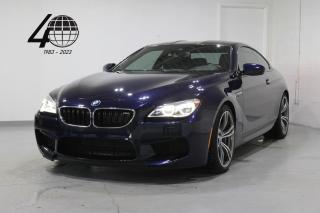 <p>A high-tech, powerful, and luxurious BMW 2-door coupe, our M6 is optioned in BMW Individual Tanzanite Blue, powered by a 4.4L twin-turbo V8 engine with a 7-speed dual-clutch transmission, putting 560 horsepower down to the rear wheels. Featuring an black leather interior and 20” alloy wheels with blue M brake calipers. </p>

<p>An extensive list of options and features include a carbon fiber roof/diffuser, Comfort Access with soft-close doors, heated/cooled/massaging front seats, heated steering, a Bang & Olufsen sound system with Apple CarPlay/Bluetooth connectivity, a heads-up display, a Surround View camera system with front/rear parking sensors, and fully configurable drive modes!</p>

<p>World Fine Cars Ltd. has been in business for over 40 years and maintains over 90 pre-owned vehicles in inventory at all times. Every certified retailed vehicle will have a 3 Month 3000 KM POWERTRAIN WARRANTY WITH SEALS AND GASKETS COVERAGE, with our compliments (conditions apply please contact for details). CarFax Reports are always available at no charge. We offer a full service center and we are able to service everything we sell. With a state of the art showroom including a comfortable customer lounge with WiFi access. We invite you to contact us today 1-888-334-2707 www.worldfinecars.com</p>