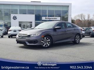 New Price! Gray 2018 Honda Civic SE w/Honda Sensing | Apple Carplay and Android Auto | FWD CVT 2.0L I4 DOHC 16V i-VTEC Bridgewater Volkswagen, Located in Bridgewater Nova Scotia.Black Cloth, 4-Wheel Disc Brakes, 8 Speakers, ABS brakes, Air Conditioning, Alloy wheels, AM/FM radio, Apple CarPlay/Android Auto, Automatic temperature control, Brake assist, Bumpers: body-colour, Compass, Delay-off headlights, Driver door bin, Driver vanity mirror, Dual front impact airbags, Dual front side impact airbags, Electronic Stability Control, Emergency communication system, Exterior Parking Camera Rear, Fabric Seating Surfaces, Four wheel independent suspension, Front anti-roll bar, Front Bucket Seats, Front reading lights, Fully automatic headlights, Heated door mirrors, Heated Front Bucket Seats, Heated front seats, Illuminated entry, Lane departure: Lane Keeping Assist System (LKAS) active, Occupant sensing airbag, Outside temperature display, Overhead airbag, Panic alarm, Passenger door bin, Passenger vanity mirror, Power door mirrors, Power steering, Power windows, Radio data system, Radio: 180-Watt AM/FM Audio System, Rear anti-roll bar, Rear window defroster, Remote keyless entry, Security system, Speed control, Speed-sensing steering, Split folding rear seat, Spoiler, Steering wheel mounted audio controls, Tachometer, Telescoping steering wheel, Tilt steering wheel, Traction control, Trip computer.Certification Program Details: 150 Points Inspection Fresh Oil Change Free Carfax Full Detail 2 years MVI Full Tank of Gas The 150+ point inspection includes: Engine Instrumentation Interior components Pre-test drive inspections The test drive Service bay inspection Appearance Final inspectionReviews:* This generation of Civic attracted shoppers with Hondas reputation for safety and reliability, and many owners report that good looks, a thoughtful and handy interior, and plenty of feature content for the money helped seal the deal. Headlight performance is highly rated, as is a smooth and punchy performance from the turbocharged engine. Source: autoTRADER.ca