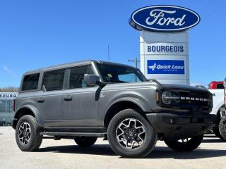 <b>Leather Seats, Navigation, 18 Aluminum Wheels!</b><br> <br> <br> <br>  With cool retro-styling, innovative features and impressive off-road capability, this legendary 2024 Ford Bronco has very little to prove. <br> <br>With a nostalgia-inducing design along with remarkable on-road driving manners with supreme off-road capability, this 2024 Ford Bronco is indeed a jack of all trades and masters every one of them. Durable build materials and functional engineering coupled with modern day infotainment and driver assistive features ensure that this iconic vehicle takes on whatever you can throw at it. Want an SUV that can genuinely do it all and look good while at it? Look no further than this 2024 Ford Bronco!<br> <br> This carbonized grey metallic SUV  has a 10 speed automatic transmission and is powered by a  275HP 2.3L 4 Cylinder Engine.<br> <br> Our Broncos trim level is Outer Banks. This Bronco Outer Banks takes things to a whole new level, with polished aluminum wheels, body colored fender flares, door handles and power heated side mirrors, along with LED headlights with high beam assist, front fog lights, and upgraded LED brake lights. This rugged off-roader also treats you with amazing comfort and connectivity features that include heated front seats, remote engine start, dual-zone climate control, front and rear cupholders, and an upgraded infotainment system with Apple CarPlay, Android Auto, SiriusXM and inbuilt navigation, to get you back home from your off-road adventures. Road safety is assured thanks to a suite of systems including blind spot detection, pre-collision assist with pedestrian detection and cross-traffic alert, lane keeping assist with lane departure warning, rear parking sensors, and driver monitoring alert. Additional features include proximity keyless entry with push button start, trail control, trail turn assist, and so much more. This vehicle has been upgraded with the following features: Leather Seats, Navigation, 18 Aluminum Wheels. <br><br> View the original window sticker for this vehicle with this url <b><a href=http://www.windowsticker.forddirect.com/windowsticker.pdf?vin=1FMDE8BH1RLA10340 target=_blank>http://www.windowsticker.forddirect.com/windowsticker.pdf?vin=1FMDE8BH1RLA10340</a></b>.<br> <br>To apply right now for financing use this link : <a href=https://www.bourgeoismotors.com/credit-application/ target=_blank>https://www.bourgeoismotors.com/credit-application/</a><br><br> <br/> See dealer for details. <br> <br>Discount on vehicle represents the Cash Purchase discount applicable and is inclusive of all non-stackable and stackable cash purchase discounts from Ford of Canada and Bourgeois Motors Ford and is offered in lieu of sub-vented lease or finance rates. To get details on current discounts applicable to this and other vehicles in our inventory for Lease and Finance customer, see a member of our team. </br></br>Discover a pressure-free buying experience at Bourgeois Motors Ford in Midland, Ontario, where integrity and family values drive our 78-year legacy. As a trusted, family-owned and operated dealership, we prioritize your comfort and satisfaction above all else. Our no pressure showroom is lead by a team who is passionate about understanding your needs and preferences. Located on the shores of Georgian Bay, our dealership offers more than just vehiclesits an experience rooted in community, trust and transparency. Trust us to provide personalized service, a diverse range of quality new Ford vehicles, and a seamless journey to finding your perfect car. Join our family at Bourgeois Motors Ford and let us redefine the way you shop for your next vehicle.<br> Come by and check out our fleet of 80+ used cars and trucks and 230+ new cars and trucks for sale in Midland.  o~o
