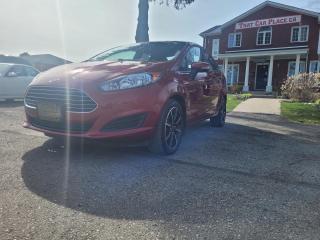 <div><b>2016 FORD FIESTA SE SEDAN 1.6L L4 DOHC 16V </b></div><br /><div>Save time money, and frustration with our transparent, no hassle pricing. Using the latest technology, we shop the competition for you and price our pre-owned vehicles to give you the best value, upfront, every time and back it up with a free market value report so you know you are getting the best deal! With no additional fees, theres no surprises either, the price you see is the price you pay, just add HST! We offer 150+ Vehicles on site with financing for our customers regardless of credit. We have a dedicated team of credit rebuilding experts on hand to help you get into the car of your dreams. We need your trade-in! We have a hassle free top dollar trade process and offer a free evaluation on your car. We will buy your vehicle even if you do not buy one from us!</div><br /><div><span><o:p></o:p></span></div><br /><div></div><br /><div><span>THAT CAR PLACE - Been in business for 27 years, we are OMVIC Certified and Member of UCDA earning your trust so you can buy with confidence.<br>150+ VEHICLES! ONE LOCATION!<br>USED VEHICLE MARKET PRICING! We use an exclusive 3rd party marketing tool that accurately monitors vehicle prices to guarantee our customers get the best value.<br>OUR POLICY!  Zero Pressure and Hassle-Free sales staff. Zero Hidden Admin Fees. Just honesty and integrity at no additional charge!<br>HISTORY: Free Carfax report included with every vehicle.<br>AWARDS:<br>National Dealer of the Year Winner of Outstanding Customer Satisfaction<br>Voted #1 Best Used Car Dealership in London, Ont. 2014 to 2024<br>Winner of Top Choice Award 6 years from 2015 to 2024<br>Winner of Londons Readers Choice Award 2014 to 2023<br>A+ Accredited Better Business Bureau rating<br>FULL SAFETY: Full safety inspection exceeding industry standards all vehicles go through an intensive inspection<br>RECONDITIONING: Any Pads or Rotors below 50% material will be replaced. You will receive a semi-synthetic oil-lube-filter and cleanup.<br>*Our Staff put in the most effort to ensure the accuracy of the information listed above. Please confirm with a sales representative to confirm the accuracy of this information*<br>**Payments are based off qualifying monthly term & 4.9% interest. Qualifying term and rate of borrowing varies by lender. Example: The cost of borrowing on a vehicle with a purchase price of $10000 at 4.9% over 60 month term is $1499.78. Rates and payments are subject to change without notice. Certified.</span></div>