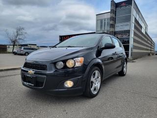 <p>SHARP 2014 CHEVY SONIC!! REALLY LOW KMS! VERY CLEAN!! SUNROOF, REVERSE CAMERA, HEATED SEATS, BLUETOOTH & MORE!! DRIVES GREAT! LOCAL ONTARIO TRADE-IN! CALL TODAY!!</p><p> </p><p>THE FULL CERTIFICATION COST OF THIS VEICHLE IS AN <strong>ADDITIONAL $690+HST</strong>. THE VEHICLE WILL COME WITH A FULL VAILD SAFETY AND 36 DAY SAFETY ITEM WARRANTY. THE OIL WILL BE CHANGED, ALL FLUIDS TOPPED UP AND FRESHLY DETAILED. WE AT TWIN OAKS AUTO STRIVE TO PROVIDE YOU A HASSLE FREE CAR BUYING EXPERIENCE! WELL HAVE YOU DOWN THE ROAD QUICKLY!!! </p><p><strong>Financing Options Available!</strong></p><p><strong>TO CALL US 905-339-3330 </strong></p><p>We are located @ 2470 ROYAL WINDSOR DRIVE (BETWEEN FORD DR AND WINSTON CHURCHILL) OAKVILLE, ONTARIO L6J 7Y2</p><p>PLEASE SEE OUR MAIN WEBSITE FOR MORE PICTURES AND CARFAX REPORTS</p><p><span style=font-size: 18pt;>TwinOaksAuto.Com</span></p>