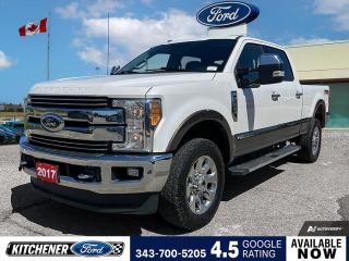 White Platinum Metallic Tri-Coat 2017 Ford F-250SD Lariat 4D Crew Cab Power Stroke 6.7L V8 DI 32V OHV Turbodiesel TorqShift 6-Speed Automatic 4WD 4WD, 10 Speakers, 4-Wheel Disc Brakes, 5th Wheel/Gooseneck Hitch Prep Package, 6 Angular Chrome Running Boards, ABS brakes, Adaptive Steering, Adjustable pedals, Air Conditioning, Alloy wheels, AM/FM radio: SiriusXM, Ambient Lighting, Auto-dimming Rear-View mirror, Automatic High Beam, Automatic temperature control, Block heater, Brake assist, Bumpers: chrome, CD player, Chrome Door & Tailgate Handles, Chrome Exhaust Tip, Chrome Package, Coloured Front & Rear Rancho Branded Shocks, Compass, Delay-off headlights, Driver door bin, Driver vanity mirror, Dual front impact airbags, Dual front side impact airbags, Easy Entry®/Exit Memory Drivers Seat Feature, Electronic Stability Control, Electronic-Locking w/3.55 Axle Ratio, Emergency communication system: SYNC 3 911 Assist, Exterior Parking Camera Rear, Flow-Through Centre Console (Column Shifter), Front anti-roll bar, Front dual zone A/C, Front fog lights, Front reading lights, Fully automatic headlights, FX4 Off-Road Package, Garage door transmitter, GVWR: 4,490 kgs (9,900 lbs) Payload Package, Heated door mirrors, Heated front seats, Hill Descent Control, Illuminated entry, Intelligent Access w/Push-Button Start, Lane-Keeping Alert, Lariat Ultimate Package, Leather Heated/Cooled Luxury Captains Chairs, Leather steering wheel, Leather-Wrapped Heated Steering Wheel, Low tire pressure warning, Memory seat, Navigation, Order Code 608A, Outside temperature display, Overhead airbag, Overhead console, Panic alarm, Passenger door bin, Passenger vanity mirror, Pedal memory, Power door mirrors, Power driver seat, Power passenger seat, Power steering, Power windows, Radio data system, Radio: Sony Premium w/In-Dash CD/MP3 Player, Rear Parking Sensors, Rear reading lights, Rear step bumper, Rear window defroster, Remote keyless entry, Remote Start System, Remote Tailgate Release, Security system, Speed control, Split folding rear seat, Steering wheel mounted audio controls, SYNC 3 Communications & Entertainment System, Tachometer, Tailgate Step & Handle w/TailGate Assist, Telescoping steering wheel, Tilt steering wheel, Traction control, Trip computer, Turn signal indicator mirrors, Twin Panel Moonroof, Unique Chrome Mirror Caps, Unique FX4 Off-Road Box Decal, Upfitter Switches (6), Variably intermittent wipers, Ventilated front seats, Wheels: 20 Aluminum PVD.
