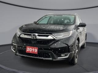<b>Sunroof,  Navigation,  Leather Seats,  Heated Seats,  Heated Steering Wheel!</b><br> <br>   With car-like handling and excellent fuel efficiency, this capable and comfort 2019 Honda CR-V is the total package. <br> <br>This stylish 2019 Honda CR-V has a spacious interior and car-like handling that captivates anyone who gets behind the wheel. With its smooth lines and sleek exterior, this gorgeous CR-V has no problem turning heads at every corner. Whether youre a thrift-store enthusiast, or a backcountry trail warrior with all of the camping gear, this practical Honda CR-V has got you covered! <br> <br> This crystal black pearl SUV  has an automatic transmission and is powered by a  1.5L I4 16V GDI DOHC Turbo engine. Driven via that economical motor it gets  8.7 L/100 km in the city and uses just  7.2 L/100 km out on the highway according to Transport Canada.<br> <br> Our CR-Vs trim level is Touring AWD. This SUV is made for the long haul with an Infotainment system that includes a 7 inch touchscreen with HondaLink, navigation, HomeLink home remote system, HandsFreeLink bilingual Bluetooth, Apple CarPlay, Android Auto, SiriusXM, a rear view camera, ambient lighting, and a premium 9 speaker sound system. To stay comfortable for the long road ahead, enjoy heated leather seats in front and back, a heated steering wheels, memory settings for the drivers seat, an auto dimming rear view mirror, rain sensing wipers, a hands free power tailgate with programmable height, woodgrain interior, a panoramic moonroof, automatic high and low beam headlights, dual-zone automatic climate control, remote start, heated seats, LED lighting, heated power mirrors, and aluminum wheels. Keeping you safe on a long drive is automatic collision mitigation braking, forward collision warning, lane departure warning, road departure mitigation, and lane keep assist, and a blind spot display and information system. This vehicle has been upgraded with the following features: Sunroof,  Navigation,  Leather Seats,  Heated Seats,  Heated Steering Wheel,  Blind Spot Display,  Automatic Braking. <br><br> <br>To apply right now for financing use this link : <a href=https://www.palladinohonda.com/finance/finance-application target=_blank>https://www.palladinohonda.com/finance/finance-application</a><br><br> <br/><br>Palladino Honda is your ultimate resource for all things Honda, especially for drivers in and around Sturgeon Falls, Elliot Lake, Espanola, Alban, and Little Current. Our dealership boasts a vast selection of high-class, top-quality Honda models, as well as expert financing advice and impeccable automotive service. These factors arent what set us apart from other dealerships, though. Rather, our uncompromising customer service and professionalism make every experience unforgettable, and keeps drivers coming back. The advertised price is for financing purchases only. All cash purchases will be subject to an additional surcharge of $2,501.00. This advertised price also does not include taxes and licensing fees.<br> Come by and check out our fleet of 110+ used cars and trucks and 60+ new cars and trucks for sale in Sudbury.  o~o