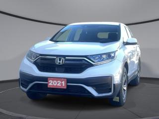 <b>Low Mileage, Heated Seats,  Lane Keep Assist,  Apple CarPlay,  Android Auto,  Remote Start!</b><br> <br>    Whether youre in the concrete jungle or remote mountain campsite, this 2021 Honda CR-V is ready to conquer all types of adventures with you. This  2021 Honda CR-V is fresh on our lot in Sudbury. <br> <br>This stylish 2021 Honda CR-V has a spacious interior and car-like handling that captivates anyone who gets behind the wheel. With its smooth lines and sleek exterior, this gorgeous CR-V has no problem turning heads at every corner. Whether youre a thrift-store enthusiast, or a backcountry trail warrior with all of the camping gear, this practical Honda CR-V has got you covered! This low mileage  SUV has just 18,409 kms. Its  white in colour  . It has an automatic transmission and is powered by a  1.5L I4 16V GDI DOHC Turbo engine.  This unit has some remaining factory warranty for added peace of mind. <br> <br> Our CR-Vs trim level is LX 4WD. This capable and comfy compact SUV offers a 7 inch touchscreen HondaLink infotainment system with HandsFreeLink bilingual Bluetooth, Apple CarPlay, Android Auto, lane keep assist, rear view camera, and a 4 speaker sound system. Other luxury features include dual-zone automatic climate control, remote start, automatic headlamps, heated seats, LED daytime running lights, heated power mirrors, and aluminum wheels.<br> This vehicle has been upgraded with the following features: Heated Seats,  Lane Keep Assist,  Apple Carplay,  Android Auto,  Remote Start,  Aluminum Wheels,  Proximity Key. <br> <br>To apply right now for financing use this link : <a href=https://www.palladinohonda.com/finance/finance-application target=_blank>https://www.palladinohonda.com/finance/finance-application</a><br><br> <br/><br>Palladino Honda is your ultimate resource for all things Honda, especially for drivers in and around Sturgeon Falls, Elliot Lake, Espanola, Alban, and Little Current. Our dealership boasts a vast selection of high-class, top-quality Honda models, as well as expert financing advice and impeccable automotive service. These factors arent what set us apart from other dealerships, though. Rather, our uncompromising customer service and professionalism make every experience unforgettable, and keeps drivers coming back. The advertised price is for financing purchases only. All cash purchases will be subject to an additional surcharge of $2,501.00. This advertised price also does not include taxes and licensing fees.<br> Come by and check out our fleet of 110+ used cars and trucks and 70+ new cars and trucks for sale in Sudbury.  o~o