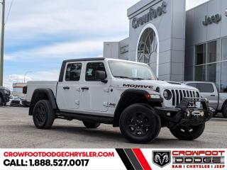 <b>Sunroof,  Aluminum Wheels,  Apple CarPlay,  Android Auto,  Off-Road Suspension!</b><br> <br> Welcome to Crowfoot Dodge, Calgarys New and Pre-owned Superstore proudly serving Albertans for 44 years!<br> <br> Compare at $54995 - Our Price is just $52995! <br> <br>   You no longer have to decide between a Jeep and a truck with the 2021 Jeep Gladiator. This  2021 Jeep Gladiator is fresh on our lot in Calgary. <br> <br>Built with unmistakable Jeep styling and off-road capability, while bringing the utility and hauling power of a pickup truck, you get the best of both worlds with this incredible machine. Thanks to its unmistakable style, rugged off-road technology, and an exhilarating open air truck experience, this unique Jeep Gladiator is ready to change the 4X4 game. This  Regular Cab 4X4 pickup  has 47,469 kms. Stock number 10684 is white in colour  . It has a 8 speed automatic transmission and is powered by a  smooth engine.  This unit has some remaining factory warranty for added peace of mind. <br> <br> Our Gladiators trim level is Mojave. With the name Mojave, you expect a truck that is ready to handle sand, rocks, and high speeds, and this Gladiator Mojave delivers. With added skid plates, Fox brand shocks, and a Fox front hydraulic jounce bumper you will be ready for even the toughest of trails. This midsize pickup is ready to handle anything the road throws at you with a trail rated badge, towing equipment, skid plates, aluminum wheels, tow hooks, removable cabin panels and windows, and fog lamps. Stay comfortable and connected on your adventures with Uconnect 4, Apple CarPlay, Android Auto, a leather steering wheel, sunroof, voice activated air conditioning, and ParkView Rear Backup Camera.  This vehicle has been upgraded with the following features: Sunroof,  Aluminum Wheels,  Apple Carplay,  Android Auto,  Off-road Suspension,  Proximity Key,  Rear Camera. <br> <br/><br> Buy this vehicle now for the lowest bi-weekly payment of <b>$345.21</b> with $0 down for 96 months @ 7.99% APR O.A.C. ( Plus GST      / Total Obligation of $71803  ).  See dealer for details. <br> <br>At Crowfoot Dodge, we offer:<br>
<ul>
<li>Over 500 New vehicles available and 100 Pre-Owned vehicles in stock...PLUS fresh trades arriving daily!</li>
<li>Financing and leasing arrangements with rates from prime +0%</li>
<li>Same day delivery.</li>
<li>Experienced sales staff with great customer service.</li>
</ul><br><br>
Come VISIT us today!<br><br> Come by and check out our fleet of 80+ used cars and trucks and 130+ new cars and trucks for sale in Calgary.  o~o