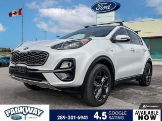 White 2020 Kia Sportage EX 4D Sport Utility 2.4L I4 DGI DOHC 6-Speed Automatic with Sportmatic AWD AWD, 3.195 Axle Ratio, Air Conditioning, Alloy wheels, AM/FM radio, AM/FM radio: SiriusXM, Cruise Control, Delay-off headlights, Driver door bin, Driver vanity mirror, Exterior Parking Camera Rear, Front Bucket Seats, Front fog lights, Fully automatic headlights, Heated door mirrors, Heated Front Bucket Seats, Heated front seats, Heated steering wheel, Illuminated entry, Outside temperature display, Passenger door bin, Passenger vanity mirror, Power door mirrors, Power driver seat, Power moonroof, Power steering, Power windows, Rear window defroster, Rear window wiper, Remote keyless entry, Roof rack: rails only, Spoiler, Steering wheel mounted audio controls, Tachometer, Telescoping steering wheel, Tilt steering wheel, Trip computer, Variably intermittent wipers.