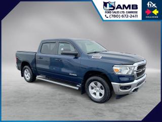 THE PRICE YOU SEE, PLUS GST. GUARANTEED!5.7 LITER V8 HEMI, 8 SPEED AUTO POWER DRIVER SEAT, CLOTH SEATS, TRAILER BRAKE CONTROLLER, UCONNECT W/ 8.4 DISPLAY.     The 2022 Ram 1500 Big Horn Crew Cab 4x4 with the 5.7 liter HEMI engine is a powerful and capable pickup truck. The 5.7 liter HEMI V8 engine produces 395 horsepower and 410 lb-ft of torque, providing plenty of power for towing and hauling. The Big Horn trim level offers a well-appointed interior with features like a touchscreen infotainment system, Apple CarPlay and Android Auto compatibility, The crew cab configuration provides ample space for passengers in both the front and rear seats, making it a comfortable option for long drives or hauling a full crew. The 4x4 capability ensures that the truck can handle rough terrain or inclement weather conditions with ease. Overall, the 2022 Ram 1500 Big Horn Crew Cab 4x4 with the 5.7 liter HEMI engine is a versatile and capable truck that is well-suited for both work and play.Do you want to know more about this vehicle, CALL, CLICK OR COME ON IN!*AMVIC Licensed Dealer; CarProof and Full Mechanical Inspection Included.
