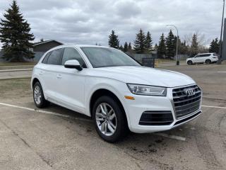 <p>Fully Inspected, ALL Work Complete and Included in Price! Call Us For More Info at 587-409-5859</p>  <p>Introducing the 2020 Audi Q5 Komfort AWD, where luxury meets versatility in an exhilarating drive. This sleek SUV embodies Audis commitment to premium craftsmanship and cutting-edge technology, ensuring every journey is nothing short of extraordinary.</p>  <p>Equipped with Audis renowned quattro® all-wheel drive system, the Q5 Komfort effortlessly conquers diverse road conditions, providing unparalleled stability and confidence in every turn. Its turbocharged engine delivers dynamic performance while maintaining impressive fuel efficiency, making it a standout in its class.</p>  <p>Step inside the meticulously crafted cabin, where comfort and sophistication await. Premium materials, ergonomic design, and advanced amenities create an inviting sanctuary for both driver and passengers. From the intuitive MMI® touch display infotainment system to the convenience of smartphone integration, the Q5 Komfort seamlessly blends connectivity and convenience for a seamless driving experience.</p>  <p>Safety is paramount, and the Q5 Komfort is equipped with a suite of intelligent driver-assist features to enhance peace of mind on the road. Whether navigating city streets or venturing off the beaten path, this Audi SUV prioritizes your safety without compromising on performance or style.</p>  <p>Experience the perfect balance of luxury and capability with the 2020 Audi Q5 Komfort AWD, where every drive is a journey to remember.</p>  <p>Call 587-409-5859 for more info or to schedule an appointment! Listed Pricing is valid for 72 hours. Financing is available, please see dealer for term availability and interest rates. AMVIC Licensed Business.</p>