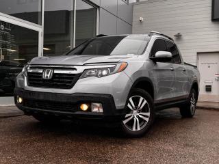 2017 Honda Ridgeline EX-L shown off in Silver! It has black leather seating, front heated seats, a leather-wrapped steering wheel with mounted audio/cruise control (adaptive), a power sunroof, blind-spot monitoring, lane-keep assist, a hard top tonneau cover, a backup camera, and so much more. Full photos and description coming soon!Please note: this vehicle has been registered in the province ofBritish Columbia and is showing a CarFax incident in the amount of $1,442.13