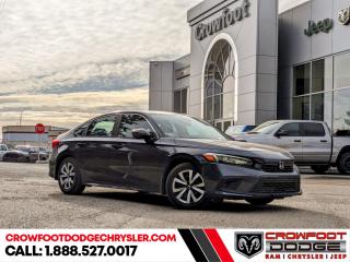 <b>Low Mileage, Heated Seats,  Apple CarPlay,  Android Auto,  Blind Spot Detection,  Adaptive Cruise Control!</b><br> <br> Welcome to Crowfoot Dodge, Calgarys New and Pre-owned Superstore proudly serving Albertans for 44 years!<br> <br> Compare at $34995 - Our Price is just $32995! <br> <br>   Back for 2023, this Honda Civic is a masterclass in style, substance and everything in-between. This  2023 Honda Civic is fresh on our lot in Calgary. <br> <br>This 2023 Honda Civic is an elegant, sporty and sophisticated vehicle worthy of your attention, with an upscale appearance, new features, and a refined cabin design. Updated tech features, premium interior build materials, unrivaled cargo space and practicality help this amazing vehicle shine in this competitive segment. No matter the task at hand, this Honda Civic is up for anything.This low mileage  coupe has just 16,899 kms. Stock number 10536A is grey in colour  . It has a cvt transmission and is powered by a  smooth engine. <br> <br> Our Civics trim level is LX. This Civic LX comes with an amazing safety suite including collision mitigation, lane keep assist, road departure mitigation, traffic sign recognition, adaptive cruise with low speed follow, blind spot monitoring, and traffic jam assist. Additional tech features come in the infotainment system, including Android Auto, Apple CarPlay, touchscreen controls, Bluetooth, and Siri Eyes Free. Other great features include heated seats for comfort, a high tech driver information center, proximity keys, remote start, and LED lighting with automatic high beams. This vehicle has been upgraded with the following features: Heated Seats,  Apple Carplay,  Android Auto,  Blind Spot Detection,  Adaptive Cruise Control,  Lane Keep Assist,  Lane Departure Warning. <br> <br/><br> Buy this vehicle now for the lowest bi-weekly payment of <b>$214.93</b> with $0 down for 96 months @ 7.99% APR O.A.C. ( Plus GST      / Total Obligation of $44705  ).  See dealer for details. <br> <br>At Crowfoot Dodge, we offer:<br>
<ul>
<li>Over 500 New vehicles available and 100 Pre-Owned vehicles in stock...PLUS fresh trades arriving daily!</li>
<li>Financing and leasing arrangements with rates from prime +0%</li>
<li>Same day delivery.</li>
<li>Experienced sales staff with great customer service.</li>
</ul><br><br>
Come VISIT us today!<br><br> Come by and check out our fleet of 90+ used cars and trucks and 130+ new cars and trucks for sale in Calgary.  o~o
