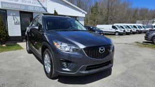 One Owner, Low Mileage!<br><br>2015 Mazda CX-5 AWD 4dr Auto Touring featuring Sunroof, Navigation, Cruize Control, Bluetooth, Handsfree phone, Heated seats, Air Conditioning and more.<br><br>Purchase price: $16,288 plus HST and LICENSING<br><br>Safety package is available for $799 and includes Ontario Certification, 3 month or 3000 km Lubrico warranty ($1000 per claim) and oil change.<br>If not certified, by OMVIC regulations this vehicle is being sold AS-lS and is not represented as being in road worthy condition, mechanically sound or maintained at any guaranteed level of quality. The vehicle may not be fit for use as a means of transportation and may require substantial repairs at the purchaser   s expense. It may not be possible to register the vehicle to be driven in its current condition.<br><br>CARFAX PROVIDED FOR EVERY VEHICLE<br><br>WARRANTY: Extended warranty with variety terms and coverages is available, please ask our representative for more details.<br>FINANCING: Regardless of your credit score, we are committed to assisting you in obtaining a customized car loan that suits your specific circumstances. Our goal is to help you enhance your credit score significantly by the time you complete your loan term. Our specialists are happy to assist you with all necessary information.<br>TRADE-IN OR SELL: Upgrade your ride by trading-in your vehicle and save on taxes, or Sell it to us, and get the best value for your current vehicle.<br><br>Smart Wheels Used Car Dealership     OMVIC Registered Dealer<br>642 Dunlop St West, Barrie, ON L4N 9M5<br>Phone: 705-721-1341 ext 201<br>Email: Info@swcarsales.ca<br>Web: www.swcarsales.ca<br>Terms and conditions may apply. Price and availability subject to change. Contact us for the latest information<br>