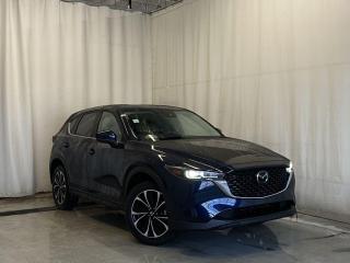 <p>NEW 2024 CX-5 GS Comfort AWD. Bluetooth, Skyactiv-G 2.5 L (Inline-4). Backup Cam, Available NAV, Leatherette/Suede Heated Seats, Advanced Keyless Remote Entry, Tilt/Sliding Moonroof, Power Trunk, Adaptive Cruise Control, Heated Steering Wheel, Wiper Blade De-Icer, Auto Dual-Zone Climate Control, Rear Air Vents, Auto Rain-Sensing Wipers, Electronic Parking Brake, 19 Machine Spokes Polished Finish Alloy Wheels</p>  <p>Includes:</p> <p>i-ACTIVSENSE + Safety Features (Smart City Brake Support-Front, Rear Cross Traffic Alert, Mazda Radar Cruise Control With Stop & Go, Distance Recognition Support System, Lane-Keep Assist System, Lane Departure Warning System, Advanced Blind Spot Monitoring)</p>  <p>Comfort Package Includes: Power glass moonroof with interior sunshade, tilt-up ventilation and one-touch open feature, Advanced Keyless Entry, Rear passenger vents (back of centre console), Automatic dual-zone climate controls</p>  <p>A joy to drive, our 2024 Mazda CX-5 GS Comfort AWD radiates refined style in Deep Crystal Blue Mica! Motivated by a 2.5 Liter 4 Cylinder that delivers 187hp tethered to a paddle-shifted 6 Speed Automatic transmission. You can put that strength to good use with the added traction of torque vectoring, and this All Wheel Drive SUV returns nearly approximately 7.8L/100km on the highway. Our CX-5 also has an expressive design with bold details like 19-inch alloy wheels, a rear roof spoiler, and bright-tipped dual exhaust outlets.</p>  <p>Our GS Comfort cabin is no ordinary interior. Its tailor-made for better travel with heated leatherette/suede power front seats, a leather-wrapped steering wheel, automatic climate control, pushbutton ignition, and keyless access. Mazda makes connecting easy by providing a 10.25-inch central display, a multifunction Commander controller, Apple CarPlay/Android Auto, Bluetooth, voice control, and six-speaker audio. The versatile rear cargo space adds adventure-friendly functionality.</p>  <p>Safety is a high priority for Mazda, which helps protect you and your loved ones with automatic emergency braking, adaptive cruise control, a rearview camera, lane-keeping assistance, blind-spot monitoring, and other intelligent technologies. With all that, our CX-5 GS Comfort is here to transcend the ordinary! Save this page, Come in for a Qualified Test Drive. We Know You Will Enjoy Your Test Drive Towards Ownership!</p>  <p>Call 587-409-5859 for more info or to schedule an appointment! Listed Pricing is valid for 72 hours. Financing is available, please see dealer for term availability and interest rates. AMVIC Licensed Business.</p>