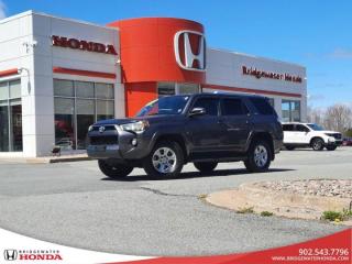 New Price! Gray 2015 Toyota 4Runner SR5 - No Accidents 4WD 5-Speed Automatic 4.0L V6 SMPI DOHC 24V Bridgewater Honda, Located in Bridgewater Nova Scotia.4WD, Cloth, 17 Aluminum Alloy Wheels w/Wheel Locks, 4-Wheel Disc Brakes, 8 Speakers, ABS brakes, Air Conditioning, Anti-whiplash front head restraints, Backup Camera, Brake assist, Bumpers: body-colour, Compass, Cruise Control, Driver door bin, Driver vanity mirror, Dual front impact airbags, Dual front side impact airbags, Electronic Stability Control, Front anti-roll bar, Front Bucket Seats, Front fog lights, Front reading lights, Front wheel independent suspension, Heated door mirrors, Illuminated entry, Independent Double Wishbone Front Suspension, Knee airbag, Leather Shift Knob, Leather steering wheel, Low tire pressure warning, Occupant sensing airbag, Outside temperature display, Overhead airbag, Overhead console, Panic alarm, Passenger door bin, Passenger vanity mirror, Power door mirrors, Power driver seat, Power steering, Power windows, Premium Cloth Seat Trim, Radio: AM/FM/CD/MP3/WMA, Rear anti-roll bar, Rear window defroster, Rear window wiper, Remote keyless entry, Roof rack: rails only, Speed-sensing steering, Split folding rear seat, Spoiler, Steering wheel mounted audio controls, Tachometer, Telescoping steering wheel, Tilt steering wheel, Traction control, Trip computer, Voltmeter.Reviews:* Owners report a high degree of off-road capability, a sense of confidence in all terrain and weather conditions, decent space, and a relatively comfortable ride. The engine is a decent all-around performer, too, according to many drivers. The high-end stereo system is a feature content favourite as well. Source: autoTRADER.ca