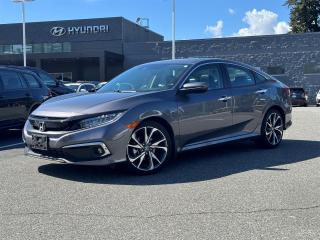 TOURING | LOW KMS | ONE OWNER | NO ACCIDENTS | NAVIGATION | LEATHER | SUNROOF | POWER SEATS | HEATED SEATS | REARVIEW CAMERA <br><br>Recent Arrival! 2020 Honda Civic Touring Gray 1.5L I4 DOHC 16V CVT FWD<br><br>Experience the epitome of style and performance with the 2020 Honda Civic Touring. This sedan redefines sophistication with its sleek design and premium features. Equipped with a powerful yet fuel-efficient engine, it delivers an exhilarating driving experience. Inside, indulge in luxury with leather-trimmed seats, a premium audio system, and advanced technology like Apple CarPlay and Android Auto integration. With Honda SensingÂ safety suite, including features like adaptive cruise control and lane-keeping assist, the Civic Touring prioritizes your safety on the road. Elevate your daily driveâvisit our dealership today to test drive the 2020 Honda Civic Touring.<br><br>Why Buy From us? <br>*7x Hyundai Presidents Award of Merit Winner <br>*3x Consumer Choice Award for Business Excellence <br>*AutoTrader Dealer of the Year <br><br>M-Promise Certified Preowned ($995 value): <br>- 30-day/2,000 Km Exchange Program <br>- 3-day/300 Km Money Back Guarantee <br>- Comprehensive 144 Point Mechanical Inspection <br>- Full Synthetic Oil Change <br>- BC Verified CarFax <br>- Minimum 6 Month Power Train Warranty <br><br>Our vehicles are priced under market value to give our customers a hassle free experience. We factor in mechanical condition, kilometres, physical condition, and how quickly a particular car is selling in our market place to make sure our customers get a great deal up front and an outstanding car buying experience overall. Dealer #31129.<br><br><br>CALL NOW!! This vehicle will not make it to the weekend!!<br><br>Reviews:<br>  * This generation of Civic attracted shoppers with Hondas reputation for safety and reliability, and many owners report that good looks, a thoughtful and handy interior, and plenty of feature content for the money helped seal the deal. Headlight performance is highly rated, as is a smooth and punchy performance from the turbocharged engine. Source: autoTRADER.ca
