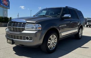 <p style=text-align: center;><strong><span style=font-size: 18pt;>2011 LINCOLN NAVIGATOR 4WD 4DR ULTIMATE</span></strong></p><p style=text-align: center;><strong><span style=font-size: 18pt;>5.4L SOHC 3-VALVE V8 FFV </span></strong></p><p style=text-align: center;><span style=font-size: 14pt;>310 HORSEPOWER | 365 LB-FT OF TORQUE</span></p><p style=text-align: center;><span style=font-size: 14pt;>12L/100KM HIGHWAY | 18L/100KM CITY | 15.5L/100KM COMBINED</span></p><p style=text-align: center;><strong><span style=font-size: 18pt;>6-SPEED AUTOMATIC TRANSMISSION</span></strong></p><p style=text-align: center;><strong><span style=font-size: 18pt;>18 7-SPOKE ALUMINUM WHEELS</span></strong></p><p style=text-align: center;> </p><p style=text-align: center;> </p><p style=text-align: center;><strong><span style=font-size: 14pt;>MECHANICAL</span></strong></p><p style=text-align: center;><span style=font-size: 14pt;>5.4L SOHC 3-valve V8 FFV, 106L fuel tank, 6-speed automatic transmission with tow/haul mode, 17-in. steel spare, Power 4-wheel disc brakes with Anti-Lock Brake System (ABS), Front and rear stabilizer bars, Independent front and rear suspension, Variable-assist power steering</span></p><p style=text-align: center;><strong><span style=font-size: 14pt;>EXTERIOR</span></strong></p><p style=text-align: center;><span style=font-size: 14pt;>Chrome-accented lower bodyside cladding, Chrome exhaust tip, Class III/IV Standard-Duty Trailer Tow Package with frame-mounted trailer hitch receiver integrated into rear fascia, 4-pin wiring harness and trailer sway control, Fog lamps, Forward Sensing System, Luggage rack with chrome accents and Black crossbars, Power-deployable running boards, Power-folding, heated sideview mirrors with chrome caps, security approach lamps, integrated turn signals, memory and driver’s side auto-dimming feature, Power liftgate, Power rear quarter windows, Privacy glass, Projector-style high-intensity discharge (HID) headlamps with autolamp feature, Rain-sensing windshield wipers: speed-sensitive intermittent (front); 2-speed wiper with washer (rear), Rear view camera, Reverse Sensing System, Tow hooks integrated into front fascia </span></p><p style=text-align: center;><strong><span style=font-size: 14pt;>INSTRUMENTATION</span></strong></p><p style=text-align: center;><span style=font-size: 14pt;>Accessory delay for power features with theater-dimming lighting, Auto-dimming rearview mirror, Leather- and wood-trimmed steering wheel with controls for audio, Lincoln SYNC,® cruise control, and Navigation System, Memory settings for driver’s seat position, sideview mirrors, power-adjustable pedals, and power-tilt steering column, Message center with compass display, distance-to-empty, average fuel economy, odometer, and trip odometer, Overhead console with 1st-row map lights, sunglasses storage, power rear quarter window switches, conversation mirror and universal garage door opener, Power-adjustable brake and accelerator pedals with memory, Power-tilt steering column with memory, Power windows with front one-touch-up/-down feature, White LED-backlit instrument cluster with speedometer, tachometer, battery gauge, fuel level gauge, coolant temperature gauge, and message center, </span></p><p style=text-align: center;><strong><span style=font-size: 14pt;>INTERIOR</span></strong></p><p style=text-align: center;><span style=font-size: 14pt;>1st-row premium leather-trimmed, heated and cooled, low-back bucket seats with 10-way power adjustments, including power lumbar and recline, 2-way adjustable head restraints with embroidered Lincoln Star, and driver’s side memory 2nd-row premium leather-trimmed, heated, low-back fold-down bucket seats with recline and easy entry to 3rd row 3rd-row, PowerFold® 60/40 split bench seat, 110V AC outlet 1st-row center floor console with floor shifter, armrest, covered storage bin with chrome handle and two-tiered storage, 2 front cupholders, auxiliary audio input jack and USB port, rear audio/climate controls, 2 headphone jacks and 2 rear cupholders 2nd-row center floor console with padded armrest, covered storage, and 2 cupholders, Authentic walnut swirl wood, Alloy Metallic and Burnished Bronze interior accents, Auxiliary climate control with 2 overhead vents for 2nd and 3rd rows, plus controls in overhead console and back of 1st-row center floor console Dual-zone electronic automatic temperature control</span></p><p style=text-align: center;><strong><span style=font-size: 14pt;>AUDIO & COMMUNICATION SYSTEMS</span></strong></p><p style=text-align: center;><span style=font-size: 14pt;>Lincoln SYNC voice-activated, in-vehicle connectivity system with SIRIUS Satellite Radio, THX® II Certified 5.1 Surround Audio System with AM/FM stereo/single-CD/ DVD/Jukebox, HD Radio technology, MP3 capability, 14 speakers (including an 8-in. rear subwoofer), 600 watts of power and 12-channel amplifier, Voice-activated Navigation System featuring SIRIUS Traffic and SIRIUS Travel Link capability, nearly 10 gigabytes of digital storage for pictures and music and on-screen image from rear view camera</span></p><p style=text-align: center;><strong><span style=font-size: 14pt;>SAFETY & SECURITY</span></strong></p><p style=text-align: center;><span style=font-size: 14pt;>3-point safety belt restraints for all seating positions; height-adjustable in 1st row AdvanceTrac® with RSC (Roll Stability ControlTM), Driver and front-passenger airbags,1 safety belt pretensioners, safety belt energy management retractors, safety belt usage sensors, driver’s seat position sensor, crash severity sensor and restraint control module, Front-seat side airbags, Lower anchors and tether anchors for child-safety seats (LATCH) in all 2nd-row seating positions; tether anchor only in 3rd-row center, MyKey® owner controls feature Perimeter anti-theft alarm, Remote Keyless Entry System with integrated keyhead transmitter remotes (2), Illuminated Entry System, and security approach lamps in sideview mirrors, Safety Canopy® System with 3-row side-curtain airbags and rollover sensor, SecuriCodeTM keyless entry keypad, SecuriLock® Passive Anti-Theft System, SOS Post-Crash Alert System</span></p><p style=text-align: center;> </p><p style=text-align: center;><strong><span style=font-size: 14pt;>OPTIONAL EQUIPMENT</span></strong></p><p style=text-align: center;><span style=font-size: 14pt;><span style=font-size: 18.6667px;><em><span style=text-decoration: underline;>Class III/IV Heavy-Duty Trailer Tow Package:</span></em><br />Frame-mounted, heavy-duty trailer hitch receiver with 4- and 7-pin wiring harness; brake module wiring, Heavy-duty radiator, flasher and transmission cooler, Rear load-leveling air suspension</span></span></p><p style=text-align: center;><em><span style=text-decoration: underline;><span style=font-size: 14pt;>Power moonroof with medium overhead console</span></span></em></p><p style=text-align: center;> </p><p style=text-align: center;> </p><p style=box-sizing: border-box; margin-bottom: 1rem; margin-top: 0px; color: #212529; font-family: -apple-system, BlinkMacSystemFont, Segoe UI, Roboto, Helvetica Neue, Arial, Noto Sans, Liberation Sans, sans-serif, Apple Color Emoji, Segoe UI Emoji, Segoe UI Symbol, Noto Color Emoji; font-size: 16px; background-color: #ffffff; text-align: center; line-height: 1;><span style=box-sizing: border-box; font-family: arial, helvetica, sans-serif;><span style=box-sizing: border-box; font-weight: bolder;><span style=box-sizing: border-box; font-size: 14pt;>Here at Lanoue/Amfar Sales, Service & Leasing in Tilbury, we take pride in providing the public with a wide variety of High-Quality Pre-owned Vehicles. We recondition and certify our vehicles to a level of excellence that exceeds the Status Quo. We treat our Customers like family and provide the highest level of service from Start to Finish. If you’d like a smooth & stress-free car shopping experience, give one of our Sales Associates a call at 1-844-682-3325 to help you find your next NEW-TO-YOU vehicle!</span></span></span></p><p style=box-sizing: border-box; margin-bottom: 1rem; margin-top: 0px; color: #212529; font-family: -apple-system, BlinkMacSystemFont, Segoe UI, Roboto, Helvetica Neue, Arial, Noto Sans, Liberation Sans, sans-serif, Apple Color Emoji, Segoe UI Emoji, Segoe UI Symbol, Noto Color Emoji; font-size: 16px; background-color: #ffffff; text-align: center; line-height: 1;><span style=box-sizing: border-box; font-family: arial, helvetica, sans-serif;><span style=box-sizing: border-box; font-weight: bolder;><span style=box-sizing: border-box; font-size: 14pt;>Although we try to take great care in being accurate with the information in this listing, from time to time, errors occur. The vehicle is priced as it is physically equipped. Minor variances will not effect pricing. Please verify the vehicle is As Expected when you visit. Thank You!</span></span></span></p>