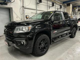 ONLY 25,000 KMS!! STUNNING 4x4 CREW CAB Z71 MIDNIGHT EDITION W/ NEARLY $6,000 IN FACTORY OPTIONS! 3.6L V6, Heavy-Duty Trailering package, premium Jet Black leather, heated seats & steering, front 1-inch levelling kit, tonneau cover, remote start, backup camera w/ rear park sensors, premium 17-inch black alloys, running boards, bed rails, premium wireless charger, automatic climate control, full power group incl. power seat, tow package, automatic headlights, auto-dimming rearview mirror, keyless entry, power locking tailgate, Bluetooth, 5-foot box w/ spray-in bedliner & cargo liner, cruise control, fog lights and Sirius XM!