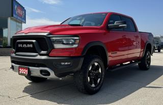 <p style=text-align: center;><span style=font-size: 18pt;><strong>2021 RAM 1500 REBEL 4X4 CREW CAB 57 BOX</strong></span></p><p style=text-align: center;><span style=font-size: 18pt;><strong> 5.7L HEMI VVT V8 ENGINE WITH FUELSAVER MDS</strong></span></p><p style=text-align: center;><span style=font-size: 14pt;>395 HORSEPOWER | 410 LB-FT OF TORQUE</span></p><p style=text-align: center;><span style=font-size: 14pt;>11L/100KM HIGHWAY | 16.1L/100KM CITY | 13.8L/100KM COMBINED</span></p><p style=text-align: center;><span style=font-size: 18pt;><strong>8-SPEED AUTOMATIC TRANSMISSION</strong></span></p><p style=text-align: center;><span style=font-size: 18pt;><strong>18 ALUMINUM DIAMOND-CUT FINISH WHEELS</strong></span></p><p style=text-align: center;> </p><p style=text-align: center;><strong><span style=font-size: 18.6667px;>STANDARD FEATURES</span></strong></p><p style=text-align: center;><span style=font-size: 14pt;>Electronic shift–on–the–fly part–time transfer case, 3.92 rear axle ratio eLocker electronic locking rear differential, Forward Collision Warning with Active Braking, Sport performance hood, Class IV hitch receiver, ParkView Rear Back–Up Camera, Brake Assist, Electronic Stability Control, Ready Alert Braking, Hill Start Assist, Traction Control, Electronic Roll Mitigation, Trailer Sway Control, Rain Brake Support, Supplemental front seat–mounted side air bags, Advanced multistage front air bags, Supplemental side curtain air bags, Tire fill alert, Push–button start, 7–pin wiring harness, Second–row in–floor storage bins</span></p><p style=text-align: center;><strong><span style=font-size: 14pt;>OPTIONAL EQUIPMENT </span></strong></p><p style=text-align: center;><em><span style=text-decoration: underline;><span style=font-size: 14pt;>Luxury leather–faced front bucket seats</span></span></em></p><p style=text-align: center;><span style=font-size: 14pt;><em><span style=text-decoration: underline;>Comfort & Convenience Group:</span></em><br />Second–row heated seats, Power 4–way front passenger lumbar adjust, Power 8–way adjustable front seats, Wireless charging pad</span></p><p style=text-align: center;><span style=font-size: 14pt;><em><span style=text-decoration: underline;>Advanced Safety Group:</span></em><br />Pedestrian Emergency Braking, Lane Departure Warning with Lane Keep Assist, Automatic high–beam headlamp control, Adaptive Cruise Control with Stop and Go, Parallel & Perpendicular Park Assist with Stop</span></p><p style=text-align: center;><span style=font-size: 14pt;><em><span style=text-decoration: underline;>Bed Utility Group:</span></em><br /></span><span style=font-size: 14pt;>4 adjustable cargo tie–down hooks, LED bed lighting, Deployable bed step, Monotone paint</span></p><p style=text-align: center;><span style=font-size: 14pt;><em><span style=text-decoration: underline;>Level 2 Equipment Group:</span></em><br />Media hub with 2 USB charging ports, Front heated seats, Rear underseat compartment storage, Remote proximity keyless entry, A/C with dual–zone automatic temperature control, Heated steering wheel, Google Android Auto, 8.4–inch touchscreen, Apple CarPlay capable, Power adjustable pedals, Remote start system, Park–Sense Front and Rear Park Assist</span></p><p style=text-align: center;><em><span style=text-decoration: underline;><span style=font-size: 14pt;>Power dual–pane panoramic sunroof</span></span></em></p><p style=text-align: center;><span style=font-size: 14pt;><em><span style=text-decoration: underline;>Rebel bodyside graphics:</span></em><br />Rear wheelhouse liners</span></p><p style=text-align: center;><em><span style=text-decoration: underline;><span style=font-size: 14pt;>124–litre (27.4–gallon) fuel tank</span></span></em></p><p style=text-align: center;><em><span style=text-decoration: underline;><span style=font-size: 14pt;>9 Alpine speakers with subwoofer</span></span></em></p><p style=text-align: center;><em><span style=text-decoration: underline;><span style=font-size: 14pt;>Active–Level 4–corner air suspension</span></span></em></p><p style=text-align: center;><span style=font-size: 14pt;><em><span style=text-decoration: underline;>Uconnect 4C NAV with 8.4–inch display:</span></em><br /></span><span style=font-size: 14pt;>A/C with dual–zone automatic temperature control, </span><span style=font-size: 14pt;>SiriusXM Travel Link, </span><span style=font-size: 14pt;>4G LTE Wi–Fi hot spot</span></p><p style=text-align: center;><em><span style=text-decoration: underline;><span style=font-size: 14pt;>Blind–Spot and Cross–Path Detection</span></span></em></p><p style=text-align: center;><em><span style=text-decoration: underline;><span style=font-size: 14pt;>Trailer Brake Control</span></span></em></p><p style=text-align: center;><em><span style=text-decoration: underline;><span style=font-size: 14pt;>Spray–in bedliner</span></span></em></p><p style=text-align: center;> </p><p style=text-align: center;> </p><p style=box-sizing: border-box; margin-bottom: 1rem; margin-top: 0px; color: #212529; font-family: -apple-system, BlinkMacSystemFont, Segoe UI, Roboto, Helvetica Neue, Arial, Noto Sans, Liberation Sans, sans-serif, Apple Color Emoji, Segoe UI Emoji, Segoe UI Symbol, Noto Color Emoji; font-size: 16px; background-color: #ffffff; text-align: center; line-height: 1;><span style=box-sizing: border-box; font-family: arial, helvetica, sans-serif;><span style=box-sizing: border-box; font-weight: bolder;><span style=box-sizing: border-box; font-size: 14pt;>Here at Lanoue/Amfar Sales, Service & Leasing in Tilbury, we take pride in providing the public with a wide variety of High-Quality Pre-owned Vehicles. We recondition and certify our vehicles to a level of excellence that exceeds the Status Quo. We treat our Customers like family and provide the highest level of service from Start to Finish. If you’d like a smooth & stress-free car shopping experience, give one of our Sales Associates a call at 1-844-682-3325 to help you find your next NEW-TO-YOU vehicle!</span></span></span></p><p style=box-sizing: border-box; margin-bottom: 1rem; margin-top: 0px; color: #212529; font-family: -apple-system, BlinkMacSystemFont, Segoe UI, Roboto, Helvetica Neue, Arial, Noto Sans, Liberation Sans, sans-serif, Apple Color Emoji, Segoe UI Emoji, Segoe UI Symbol, Noto Color Emoji; font-size: 16px; background-color: #ffffff; text-align: center; line-height: 1;><span style=box-sizing: border-box; font-family: arial, helvetica, sans-serif;><span style=box-sizing: border-box; font-weight: bolder;><span style=box-sizing: border-box; font-size: 14pt;>Although we try to take great care in being accurate with the information in this listing, from time to time, errors occur. The vehicle is priced as it is physically equipped. Minor variances will not effect pricing. Please verify the vehicle is As Expected when you visit. Thank You!</span></span></span></p>