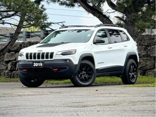 Panoramic Sunroof, Heated & Ventilated Seats, Navigation, Backup Cam, Apple Carplay/Android Auto, Blind Spot Monitoring, and more!

Meet our Low KM 2019 Jeep Cherokee Trailhawk Elite 4WD on display in Bright White! Powered by a 3.2 Litre V6 that generates 271hp connected to a 9 Speed Automatic transmission for easy passing. This Four Wheel Drive SUV loves to explore back roads, go mudding, cross country, or rock-crawling with ease thanks to the locking rear axle, a 1-inch lift with off-road suspension, and functional skid plates plus appreciate approximately 9.8L/100km on the highway. Our Trailhawk Elite combines classic Jeep elements with a modern and aerodynamic shape accented by off-road aluminum wheels, all-terrain tires, and accent colour tow hooks.

Inside our Trailhawk Elite, youll see that the cabins layout is driver-friendly. Keyless remote entry, a massive sunroof, power accessories, heated front seats, a heated steering wheel, and a convenient 60/40-split folding and reclining rear seat come in handy. Along with full-color navigation, youll also enjoy a prominent touchscreen audio display, integrated voice command with Bluetooth®, and available satellite radio. Whether out pounding snowdrifts into submission or coasting down the freeway, our Jeep Trailhawk Elite has all the creature comforts youll need to keep that smile on your face.

Jeep offers ABS, a rearview camera, stability/traction control, and multiple airbags in place to keep you safe and secure. The Cherokee Trailhawk Elite has a winning combination of capability, comfort, and style sure to please you! Save this Page and Call for Availability. We Know You Will Enjoy Your Test Drive Towards Ownership! 

Bustard Chrysler prides ourselves on our expansive used car inventory. We have over 100 pre-owned units in stock of all makes and models, with the largest selection of pre-owned Chrysler, Dodge, Jeep, and RAM products in the tri-cities. Our used inventory is hand-selected and we only sell the best vehicles, for a fair price. We use a market-based pricing system so that you can be confident youre getting the best deal. With over 25 years of financing experience, our team is committed to getting you approved - whether you have good credit, bad credit, or no credit! We strive to be 100% transparent, and we stand behind the products we sell. For your peace of mind, we offer a 3 day/250 km exchange as well as a 30-day limited warranty on all certified used vehicles.