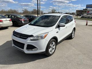 The 2015 Ford Escape SE is a compact SUV that boasts a powerful EcoBoost 1.6L Turbo I4 engine, capable of producing 178 horsepower and 184 lb-ft of torque. This engine is mated to a 6-speed automatic transmission, providing smooth and efficient shifting. 



The exterior of the 2015 Ford Escape SE is sleek and modern, with a dynamic grille and sculpted lines. It comes standard with 17-inch alloy wheels, automatic headlights, fog lights, and a rear spoiler. Other exterior features include power mirrors, a roof rack, and a rearview camera for added convenience. 



Moving inside, the 2015 Ford Escape SE offers a spacious and comfortable cabin that is packed with standard features. It has seating for up to five passengers, with cloth upholstery and a 6-way power-adjustable drivers seat. The rear seats are split-folding and can be folded flat to create additional cargo space. 



The infotainment system is centered around a 6-speaker audio system with a 4.2-inch display screen, Bluetooth connectivity, and a USB port. It also comes with a CD player, satellite radio, and an auxiliary audio jack. Other interior features include a tilt-and-telescoping steering wheel, air conditioning, and a 60/40-split folding and reclining rear seat. 



Safety features on the 2015 Ford Escape SE include antilock disc brakes, traction and stability control, front-seat side airbags, a driver knee airbag, and full-length side curtain airbags. It also comes with MyKey, which allows parents to set speed and audio limits for their teenage drivers. 



Overall, the 2015 Ford Escape SE is a well-rounded compact SUV that offers a comfortable ride, powerful engine, and a long list of standard features. Whether youre commuting to work or hitting the open road, the Escape SE is sure to impress.