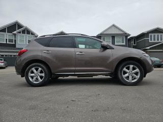 <p>This vehicle is in great condition. Ideal for a family or first time vehicle owner. Great gas mileage as a daily driver. <br /><br />2010 Nissan Murano SL (Top of the line spec) <br /><br />- AWD Low Kms for a 2010 vehicle - 143k 3.5L V6 <br />- Active status<br />- Dual-zone auto climate control <br />- Bose speakers <br />- Cruise control <br />- Full panel Sun roof <br />- Great storage space in the boot with foldable rear seats <br />- Rear AC and heating panel <br />- Remote Powerlift gate <br />- Touch start and more.<br /><br />Test drive this vehicle today.<br /><br />AMVIC certified.<br /><br />GST not included. Financing available.<br /><br /><a href=https://vhr.carfax.ca/?id=Mk5L%2B3%2FV7OKzXBhB0LQAs7SHLRRkiLNJ target=_blank rel=noopener>View Carfax Report</a> </p>