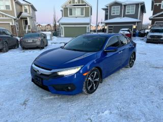 <p>2017 Honda Civic - Touring Edition (Top of the line) Low KMS <br /><br />- 125k -Active Status <br />- Blind Spot Display <br />- Multi-Angle Rear View Camera <br />- Adaptive Cruise Control with Low-Speed Follow <br />- Lane Keeping Assist <br />- Lane Departure Warning <br />- Road Departure Mitigation <br />- Forward Collision Warning <br />- Collision Mitigation Braking <br />- Leather, Heated, and Power Front Seats <br />- Heated Rear Seats <br />- Remote Start <br />- Power Sunroof <br />- Wireless Phone Charging <br />- Rain Sensing Windshield Wipers <br />- Turbocharged <br />- Proximity Key Entry <br />- Pushbutton Start <br />- Walk Away Door Locks <br />- Alloy Wheels <br />- Dual Auto Climate Control <br />- Rear Air Vents <br />- A/C <br />-Cruise Control.<br /><br />Extremely good on gas. Vehicle does have moderate Hail damage towards the rear and top of the vehicle. (please see images) - does not affect driving or core functionality at all. <br /><br />AMVIC certified. GST not included. Financing Available.<br /><br /><a href=https://vhr.carfax.ca/?id=jKSDcSGqlcKlEO6PGcXEg61sdLfQfAgM target=_blank rel=noopener>View Carfax Report</a></p>