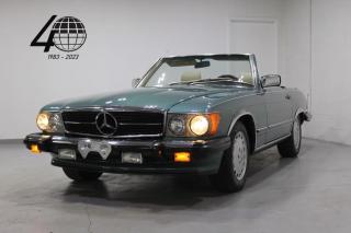 <p>Our 1988 560SL is a classic Mercedes roadster with a folding soft-top roof, matching hard-top, and 5.6L V8 engine! Featuring timeless design in Blue Green with chrome trim, over a beige leather interior with wood trim, on 15” Gullideckel wheels, along with an original Becker head unit, cruise control, and more!</p>

<p>World Fine Cars Ltd. has been in business for over 40 years and maintains over 90 pre-owned vehicles in inventory at all times. Every certified retailed vehicle will have a 3 Month 3000 KM POWERTRAIN WARRANTY WITH SEALS AND GASKETS COVERAGE, with our compliments (conditions apply please contact for details). CarFax Reports are always available at no charge. We offer a full service center and we are able to service everything we sell. With a state of the art showroom including a comfortable customer lounge with WiFi access. We invite you to contact us today 1-888-334-2707 www.worldfinecars.com</p>