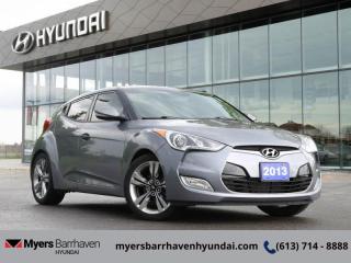 Compare at $11320 - Our Price is just $10990! <br> <br>   A sports car/coupe that ranks high on the practicality scale without sacrificing its looks or purpose. The Veloster is truly a one off. This  2015 Hyundai Veloster is fresh on our lot in Ottawa. <br> <br>Strikingly different than any car on the road, the Veloster is that rare breed of truly unique. But what really sets this Veloster apart is innovation. A hidden door for easy rear-seat access, standard 7 inch touch-screen display, while offering up a comfortable ride, very good fuel economy and wrapped in a sporty body is what really separates itself from other cars in its class. The 2015 Hyundai Veloster stands out from the crowd thanks to its long and low profile, large wheel arches and a sloping roof. This  hatchback has 128,128 kms. Its  grey in colour  . It has a manual transmission and is powered by a  138HP 1.6L 4 Cylinder Engine.  <br> <br/><br> Buy this vehicle now for the lowest bi-weekly payment of <b>$91.34</b> with $0 down for 72 months @ 6.99% APR O.A.C. ( Plus applicable taxes -  & fees   ).  See dealer for details. <br> <br>*LIFETIME ENGINE TRANSMISSION WARRANTY NOT AVAILABLE ON VEHICLES WITH KMS EXCEEDING 140,000KM, VEHICLES 8 YEARS & OLDER, OR HIGHLINE BRAND VEHICLE(eg. BMW, INFINITI. CADILLAC, LEXUS...)<br> Come by and check out our fleet of 30+ used cars and trucks and 80+ new cars and trucks for sale in Ottawa.  o~o