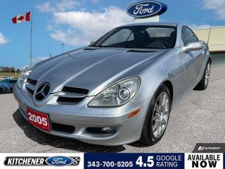 Iridium Silver Metallic 2005 Mercedes-Benz SLK 350 2D Convertible 3.5L V6 SMPI DOHC 7-Speed Automatic Electronic with Overdrive RWD 17 10-Spoke Alloy Wheels, 4-Wheel Disc Brakes, 9 Speakers, ABS brakes, Air Conditioning, Alloy wheels, AM/FM radio, AM/FM Stereo w/Single CD, Auto-dimming door mirrors, Auto-dimming Rear-View mirror, Automatic temperature control, Brake assist, Bumpers: body-colour, CD player, Child-Seat-Sensing Airbag, Convertible HardTop, Convertible roof lining, Convertible roof wind blocker, Delay-off headlights, Driver door bin, Driver vanity mirror, Dual front impact airbags, Dual front side impact airbags, Electronic Stability Control, Four wheel independent suspension, Front anti-roll bar, Front Bucket Seats, Front dual zone A/C, Front fog lights, Front reading lights, Front Sport Bucket Seats, Fully automatic headlights, Garage door transmitter: HomeLink, Glass rear window, Heated door mirrors, Illuminated entry, Integrated roll-over protection, Knee airbag, Leather Shift Knob, Leather steering wheel, Leather Upholstery, Occupant sensing airbag, Outside temperature display, Panic alarm, Passenger door bin, Passenger vanity mirror, Power convertible roof, Power door mirrors, Power steering, Power windows, Radio data system, Rear anti-roll bar, Rear fog lights, Rear window defroster, Remote keyless entry, Security system, Speed control, Sport steering wheel, Steering wheel mounted audio controls, Tachometer, Telescoping steering wheel, Tilt steering wheel, Traction control, Trip computer, Turn signal indicator mirrors, Variably intermittent wipers, Weather band radio.