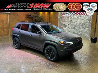 <strong>*** GRANITE METALLIC 4WD CHEROKEE TRAILHAWK!! *** HEATED SEATS & WHEEL, REMOTE START, NAVIGATION!! *** 8.4 INCH TOUCHSCREEN, CARPLAY & ANDROID AUTO, POWER LIFT GATE!! *** </strong>Low low mileage (Just 17,000kms!) with excellent history as reported by Carfax!! Excellent condition, with <strong>TONS OF FACTORY WARRANTY </strong>Remaining!! Comfortable, capable and powerful, this Jeep is ready to rip through the toughest of trails with ease! Trailhawk trim equipped with the Customer Preferred Package loaded up with <strong>HEATED SEATS</strong>......<strong>HEATED STEERING WHEEL</strong>......<strong>REMOTE START</strong>......<strong>GPS NAVIGATION</strong>......Sleek Black Interior<strong> </strong>w/ Red Contrast Stitching......Big <strong>8.4 INCH MULTIMEDIA TOUCHSCREEN</strong>......<strong>CARPLAY & ANDROID AUTO</strong>......Backup Camera......Dual Rear USB Ports......<strong>POWER LIFT GATE</strong>......Keyless Entry......SiriusXM Satellite Radio......Dual Zone Automatic Climate Control......Hill Start Assist......<strong>4G LTE HOTSPOT</strong>......<strong>LED </strong>Lights......<strong>HID </strong>Projector Headlights......Fog Lights......Red Trailhawk Tow Hooks......Dual Exit Exhaust......Privacy Tinted Windows......<strong>UNDERBODY SKID PLATES</strong>......<strong>TOW PACKAGE </strong>w/ Hitch Receiver......Digital <strong>VIC </strong>(Vehicle Information Center)......Electronic Parking Brake......<strong>3.2L V6 ENGINE</strong>......<strong>9-SPEED </strong>Shiftable Automatic Transmission......Sleek <strong>17 INCH ALLOY RIMS </strong>w/ <strong>FIRESTONE </strong>Tires!!<br /><br />This Trailhawk comes with all original Books & Manuals, two sets of Keys & Fobs, All Weather Mats and balance of Factory <strong>JEEP WARRANTY!! </strong>Now sale priced at just $39,800 with Financing & Extended Warranty available!!<br /><br /><br />Will accept trades. Please call <a href=\tel:(204)560-6287\>(204)560-6287</a> or View at 3165 McGillivray Blvd. (Conveniently located two minutes West from Costco at corner of Kenaston and McGillivray Blvd.)<br /><br />In addition to this please view our complete inventory of used <a href=\https://www.autoshowwinnipeg.com/used-trucks-winnipeg/\>trucks</a>, used <a href=\https://www.autoshowwinnipeg.com/used-cars-winnipeg/\>SUVs</a>, used <a href=\https://www.autoshowwinnipeg.com/used-cars-winnipeg/\>Vans</a>, used <a href=\https://www.autoshowwinnipeg.com/new-used-rvs-winnipeg/\>RVs</a>, and used <a href=\https://www.autoshowwinnipeg.com/used-cars-winnipeg/\>Cars</a> in Winnipeg on our website: <a href=\https://www.autoshowwinnipeg.com/\>WWW.AUTOSHOWWINNIPEG.COM</a><br /><br />Complete comprehensive warranty is available for this vehicle. Please ask for warranty option details. All advertised prices and payments plus taxes (where applicable).<br /><br />Winnipeg, MB - Manitoba Dealer Permit # 4908