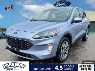 Iced Blue Silver Metallic 2022 Ford Escape SEL 303A 303A 4D Sport Utility 2.5L iVCT eCVT AWD 2.5L iVCT, eCVT, AWD, 2.91 Axle Ratio, Adaptive Cruise Control (ACC) w/Stop & Go, Air Conditioning, Alloy wheels, AM/FM radio: SiriusXM, Auto High-beam Headlights, Compass, Delay-off headlights, Driver door bin, Driver vanity mirror, Electronic Fuel Door Release, Equipment Group 303A, Evasive Steering Assist, Ford Co-Pilot360 Assist+, Front Bucket Seats, Front dual zone A/C, Front fog lights, Fully automatic headlights, Heated front seats, Instrument Panel w/6.5 Digital Screen, Neutral Towing Capability, Passenger door bin, Passenger vanity mirror, Pedestrian Alert Sounder, Power driver seat, Power steering, Power windows, Rear window defroster, Remote keyless entry, Speed Sign Recognition, Steering wheel mounted audio controls, Variably intermittent wipers, Voice-Activated Touchscreen Navigation System.