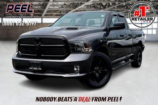 2021 Ram 1500 Classic Quad Cab | 3.6L V6 | Granite Crystal Metallic | Night Edition | Sub Zero Package | Premium Bucket Seats | Heated Seats | Heated Steering Wheel | Remote Start | 8.4" Touchscreen | Apple CarPlay & Android Auto | Remote Start | Tonneau Cover | Side Steps | Class IV Hitch Receiver | 3.55 Rear Axle Ratio | Sport Performance Hood

Clean Carfax No Accidents

Discover the 2021 Ram 1500 Classic Quad Cab, an exceptional blend of style and functionality, finished in Granite Crystal Metallic. This truck boasts the Night Edition and Sub Zero Package, featuring premium bucket seats, heated seats, and a heated steering wheel. Enjoy modern tech with an 8.4" touchscreen, Apple CarPlay, Android Auto, and remote start. Practical additions include a tonneau cover, side steps, and a Class IV hitch receiver. Enhanced with a Sport Performance Hood and 3.55 rear axle ratio, this Ram 1500 combines rugged capability with refined comfort.
______________________________________________________

Engage & Explore with Peel Chrysler: Whether youre inquiring about our latest offers or seeking guidance, 1-866-652-6197 connects you directly. Dive deeper online or connect with our team to navigate your automotive journey seamlessly.

WE TAKE ALL TRADES & CREDIT. WE SHIP ANYWHERE IN CANADA! OUR TEAM IS READY TO SERVE YOU 7 DAYS! COME SEE WHY NOBODY BEATS A DEAL FROM PEEL! Your Source for ALL make and models used cars and trucks
______________________________________________________

*FREE CarFax (click the link above to check it out at no cost to you!)*

*FULLY CERTIFIED! (Have you seen some of these other dealers stating in their advertisements that certification is an additional fee? NOT HERE! Our certification is already included in our low sale prices to save you more!)

______________________________________________________

Peel Chrysler  A Trusted Destination: Based in Port Credit, Ontario, we proudly serve customers from all corners of Ontario and Canada including Toronto, Oakville, North York, Richmond Hill, Ajax, Hamilton, Niagara Falls, Brampton, Thornhill, Scarborough, Vaughan, London, Windsor, Cambridge, Kitchener, Waterloo, Brantford, Sarnia, Pickering, Huntsville, Milton, Woodbridge, Maple, Aurora, Newmarket, Orangeville, Georgetown, Stouffville, Markham, North Bay, Sudbury, Barrie, Sault Ste. Marie, Parry Sound, Bracebridge, Gravenhurst, Oshawa, Ajax, Kingston, Innisfil and surrounding areas. On our website www.peelchrysler.com, you will find a vast selection of new vehicles including the new and used Ram 1500, 2500 and 3500. Chrysler Grand Caravan, Chrysler Pacifica, Jeep Cherokee, Wrangler and more. All vehicles are priced to sell. We deliver throughout Canada. website or call us 1-866-652-6197. 

Your Journey, Our Commitment: Beyond the transaction, Peel Chrysler prioritizes your satisfaction. While many of our pre-owned vehicles come equipped with two keys, variations might occur based on trade-ins. Regardless, our commitment to quality and service remains steadfast. Experience unmatched convenience with our nationwide delivery options. All advertised prices are for cash sale only. Optional Finance and Lease terms are available. A Loan Processing Fee of $499 may apply to facilitate selected Finance or Lease options. If opting to trade an encumbered vehicle towards a purchase and require Peel Chrysler to facilitate a lien payout on your behalf, a Lien Payout Fee of $299 may apply. Contact us for details. Peel Chrysler Pre-Owned Vehicles come standard with only one key.
