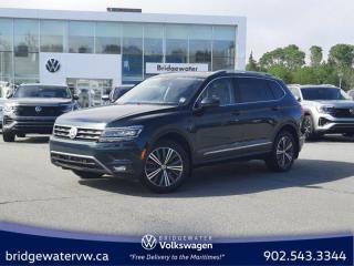 Recent Arrival! Dark Moss Green Metallic 2018 Volkswagen Tiguan Highline 4Motion | Apple Carplay | Sirus XM | Android Auto AWD 8-Speed Automatic with Tiptronic 2.0L TSI Bridgewater Volkswagen, Located in Bridgewater Nova Scotia.AWD, 3.33 Axle Ratio, 4-Wheel Disc Brakes, 8 Speakers, ABS brakes, Air Conditioning, Alloy wheels, AM/FM radio: SiriusXM, Auto-dimming Rear-View mirror, Automatic temperature control, Bluetooth Mobile Phone Connectivity, Brake assist, Bumpers: body-colour, Compass, Delay-off headlights, Driver door bin, Driver vanity mirror, Dual front impact airbags, Dual front side impact airbags, Electronic Stability Control, Exterior Parking Camera Rear, Fender Premium Audio System w/8 Speakers, Four wheel independent suspension, Front anti-roll bar, Front Bucket Seats, Front dual zone A/C, Front fog lights, Front reading lights, Fully automatic headlights, Heated door mirrors, Heated Front Comfort Seats, Heated front seats, Heated steering wheel, Illuminated entry, Leather Shift Knob, Low tire pressure warning, Memory seat, Navigation System, Occupant sensing airbag, Outside temperature display, Overhead airbag, Overhead console, Panic alarm, Passenger door bin, Passenger vanity mirror, Power door mirrors, Power driver seat, Power Liftgate, Power moonroof, Power steering, Power windows, Radio data system, Radio: Discover Media w/8.0 Touchscreen, Rain sensing wipers, Rear anti-roll bar, Rear reading lights, Rear window defroster, Rear window wiper, Remote CD player, Remote keyless entry, Roof rack: rails only, Security system, SiriusXM Satellite Radio, Speed control, Speed-sensing steering, Split folding rear seat, Spoiler, Steering wheel mounted audio controls, Tachometer, Telescoping steering wheel, Tilt steering wheel, Traction control, Trip computer, Turn signal indicator mirrors, USB Audio Input (x3), Variably intermittent wipers, Vienna Leather Seating Surfaces.Volkswagen Certified Details:* Prepaid Maintenance is now available for Certified Pre-Owned Volkswagens. Lock in your maintenance fees by choosing between a 2- or 3-year plan. Vehicles up to 7 years of age are eligible for the purchase of our Prepaid Maintenance plans regardless of mileage. A 3-month SiriusXM all-access trial subscription / Recent college, CEGEP or university Graduates can get a $500 rebate / CARFAX Vehicle History Report. A 3-month SiriusXM all-access trial subscription* Finance rates from 4.99%* A completed 112-point inspection plus mechanical and appearance reconditioning assessment performed by a Volkswagen factory-trained technician* Any remaining new-vehicle limited warranty. Certified Pre-Owned vehicles are eligible for extended warranty coverage, giving you greater peace of mind* A 6-month subscription to Volkswagen 24-hour roadside assistanceReviews:* Owners and experts alike almost universally count the Tiguans ride quality, highway manners, interior, and overall easy-to-drive character among its most valuable assets. The central touchscreen infotainment system and all-digital instrument cluster are commonly listed as feature favourites, as they add a high-tech flair to the driving environment. Source: autoTRADER.ca