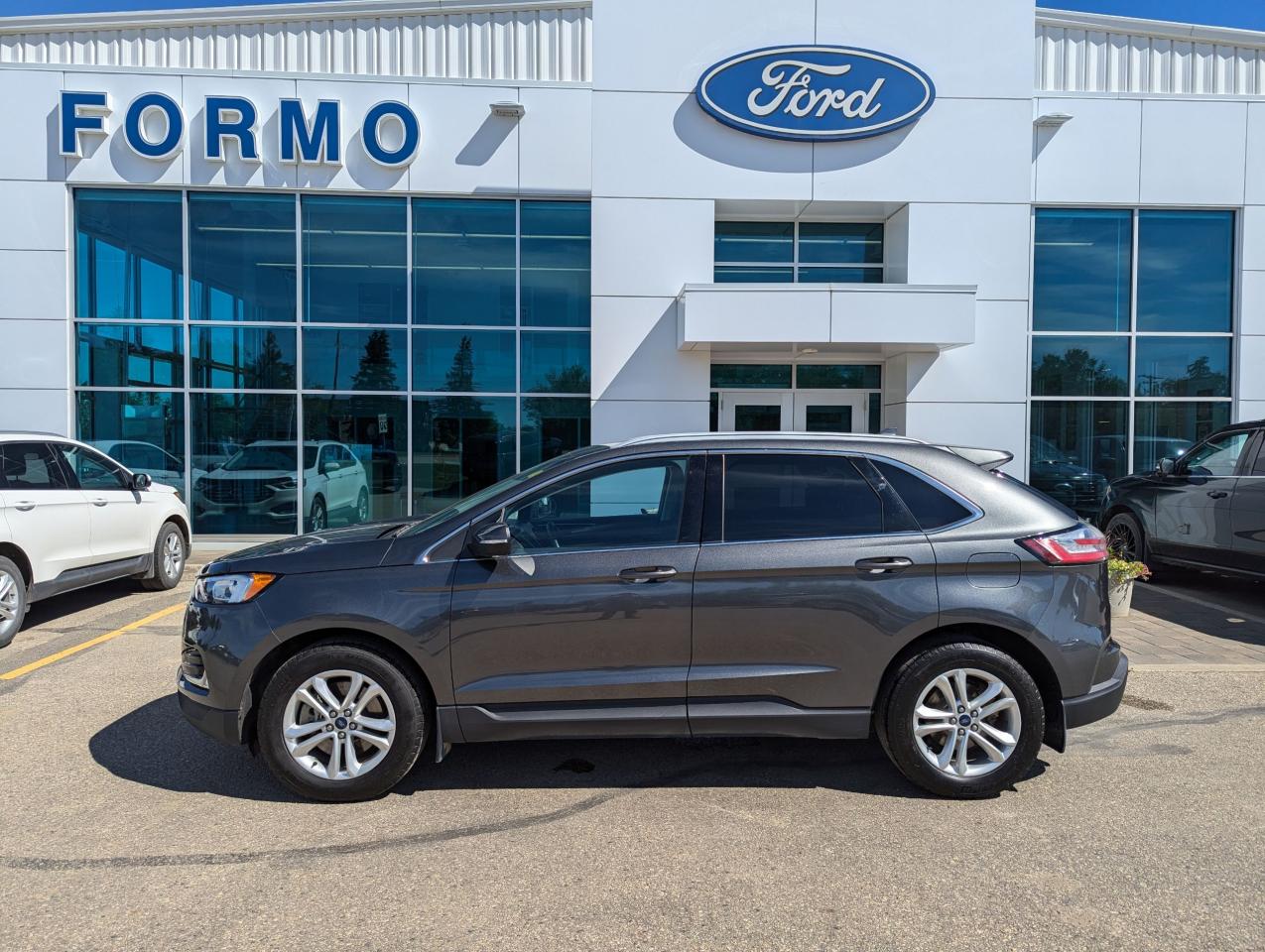 <p>Looking for a stylish and versatile SUV that wont break the bank? Look no further than this 2020 Ford Edge SEL, now available at Formo Motors! This Magnetic Metallic beauty features a sleek and modern design that turns heads wherever you go. Step inside and enjoy the comfort of black cloth bucket seats. This Edge is equipped with a powerful 2.0L I4 Turbo engine, delivering a smooth and responsive ride, and with its All Wheel Drive system, you can confidently tackle any weather condition.</p><p>This well-maintained Edge has only 67,134km on the odometer, making it the perfect blend of reliability and affordability. Here are just a few of the features that make this Edge so special:</p><ul><li><strong>Sleek Magnetic Metallic Exterior</strong>: Turn heads with this sophisticated colour choice.</li><li><strong>Powerful 2.0L I4 Turbo Engine</strong>: Experience smooth acceleration and responsive handling.</li><li><strong>All Wheel Drive</strong>: Enjoy confident driving in all weather conditions.</li><li><strong>Comfortable Cloth Bucket Seats</strong>: Relax and enjoy the ride in luxurious comfort.</li><li><strong>Low Mileage</strong>: This Edge is barely broken in, offering years of driving enjoyment ahead.</li></ul><p>Dont miss out on this fantastic opportunity to own a reliable and stylish SUV. Visit Formo Motors today to learn more!</p>