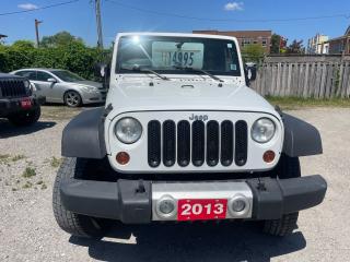<div>2013 jeep wrangler Sahara package white with black interior and black top has clean carfax no accidents reported comes with 4WD automatic transmission power windows and locks navigation keyless entry and much more looks and runs great </div>