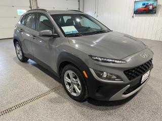 <div>The 2022 Hyundai KONA SE is a stylish and modern SUV designed to turn heads and elevate your driving experience. With its sleek Gray exterior and contrasting Black interior, this vehicle exudes a contemporary and sophisticated vibe. </div><br /><div><br></div><br /><div>Under the hood, the KONA SE is powered by a robust 2.0L Naturally Aspirated Inline-4 engine paired with a 7-speed automatic transmission. This combination, along with the All-Wheel Drive (AWD) system, ensures a smooth and responsive driving experience.</div><br /><div><br></div><br /><div>Here are some of the standout features of this SUV:</div><br /><div><br></div><br /><div>- **Wheels & Tires**:</div><br /><div>  - 17-inch aluminum alloy wheels</div><br /><div>  - Heated side mirrors</div><br /><div><br></div><br /><div>- **Safety & Assistance**:</div><br /><div>  - Blind Spot Collision Assist </div><br /><div>  - Rear Cross-Traffic Collision Assist</div><br /><div>  - Forward Collision Assist</div><br /><div>  - Lane Departure Warning</div><br /><div>  - Rearview Camera</div><br /><div><br></div><br /><div>- **Convenience & Comfort**:</div><br /><div>  - Keyless entry and start </div><br /><div>  - Heated front seats</div><br /><div>  - Heated steering wheel</div><br /><div>  - Dual Climate Control</div><br /><div>  - Air Conditioning (A/C)</div><br /><div>  - Power Windows</div><br /><div>  - Power Door Locks</div><br /><div>  - Cruise Control</div><br /><div>  - Tilt and Telescopic Steering Wheel</div><br /><div>  - Steering Wheel Controls</div><br /><div><br></div><br /><div>- **Infotainment & Connectivity**:</div><br /><div>  - 8-inch touchscreen display </div><br /><div>  - Apple CarPlay and Android Auto compatibility</div><br /><div><br></div><br /><div>- **Safety**:</div><br /><div>  - Vehicle Stability Management (VSM)</div><br /><div>  - Traction Control</div><br /><div>  - Assisted Braking</div><br /><div>  - Anti-lock Brakes (ABS)</div><br /><div>  - Child Safety Locks</div><br /><div>  - Passenger Front Airbag Off/On</div><br /><div>  - Driver Side Airbag</div><br /><div>  - Theft Deterrent/Alarm</div><br /><div><br></div><br /><div>- **Additional Features**:</div><br /><div>  - Daytime Running Lights</div><br /><div>  - Trip Computer</div><br /><div><br></div><br /><div>The SUV is designed with both the driver and passengers in mind, offering a blend of performance, safety, and comfort features. Whether youre commuting through the city or heading out on a long highway drive, the 2022 Hyundai KONA SE ensures that you do so in style and with confidence.</div><br /><div><br></div><br /><div>At Sisson Auto, we strive to make your vehicle purchase seamless and stress-free. Our transparent pricing eliminates haggling and hidden fees. To give you peace of mind, we offer a 3-day/600 km No-Hassle Return Policy, a 30-day exchange privilege, minimum warranties with 24-hour roadside assistance, and a safety recall check. Additionally, a complimentary CarFax history report is provided, and home delivery is free within 200 km. Dealer permit #5471.</div><br /><div>** This description was written by AI based on information provided about the vehicle. AI can sometimes produce incorrect information. Please confirm all details with the dealership. </div>