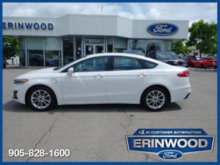 Elevate Your Drive with Modern Efficiency and Style  This 2020 Ford Fusion Energi, in a striking Oxford White, is a used, automatic, front-wheel-drive sedan powered by a hybrid engine. Its sleek design and efficient performance make it a standout choice for discerning drivers.  The SEL trim of this Fusion Energi brings a host of premium features. Inside, youll find a spacious and comfortable cabin with leather-trimmed seats and a power-adjustable drivers seat. The infotainment system includes an 8-inch touchscreen with SYNC 3, Apple CarPlay, and Android Auto integration, ensuring you stay connected on the go. Safety is paramount with advanced features like blind-spot monitoring, lane-keeping assist, and adaptive cruise control. The exterior is complemented by LED headlights and 18-inch alloy wheels, adding to its sophisticated look.  Experience the perfect blend of luxury and efficiency. This vehicle offers a refined driving experience with its advanced hybrid technology, providing impressive fuel economy without compromising on power. The sleek Oxford White exterior and well-appointed interior make it a stylish choice for any journey. Advanced safety features and modern tech ensure that every drive is both safe and enjoyable.  ‌