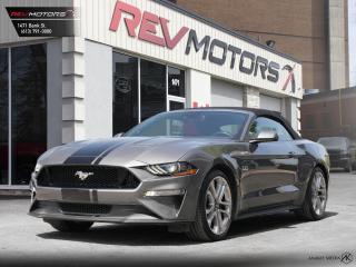 2021 Ford Mustang GT Premium | 5.0L | Nav | Reverse Camera | 6-Speed Manual | Heated and Ventilated Seats<br/>  <br/> Grey Exterior | Red Leather Interior | Black Soft Top | 6-Speed Manual Transmission | Alloy Wheels | Blind Spot Assist | Keyless Entry | Front Power Seats | Navigation | Voice Control | Bluetooth Connection | Cruise Control | Front Heated and Ventilated Seats | Push Button Start | Rearview Camera and much more. <br/> <br/>  <br/> This vehicle ahs travelled 32,496 Kms.  <br/> <br/>  <br/> *** NO additional fees except for taxes and licensing! *** <br/> <br/>  <br/> *** 100-point inspection on all our vehicles & always detailed inside and out *** <br/> <br/>  <br/> RevMotors is at your service to ensure you find the right car for YOU. Even if we do not have it in our inventory, we are more than happy to find you the vehicle that you are looking for. Give us a call at 613-791-3000 or visit us online at www.revmotors.ca <br/> <br/>  <br/> a nous donnera du plaisir de vous servir en Franais aussi! <br/> <br/>  <br/> CERTIFICATION * All our vehicles are sold Certified and E-Tested for the province of Ontario (Quebec Safety Available, additional charges may apply) <br/> FINANCING AVAILABLE * RevMotors offers competitive finance rates through many of the major banks. Should you feel like youve had credit issues in the past, we have various financing solutions to get you on the road.  We accept No Credit - New Credit - Bad Credit - Bankruptcy - Students and more!! <br/> EXTENDED WARRANTY * For your peace of mind, if one of our used vehicles is no longer covered under the manufacturers warranty, RevMotors will provide you with a 6 month / 6000KMS Limited Powertrain Warranty. You always have the options to upgrade to more comprehensive coverage as well. Well be more than happy to review the options and chose the coverage thats right for you! <br/> TRADES * Do you have a Trade-in? We offer competitive trade in offers for your current vehicle! <br/> SHIPPING * We can ship anywhere across Canada. Give us a call for a quote and we will be happy to help! <br/> <br/>  <br/> Buy with confidence knowing that we always have your best interests in mind! <br/>