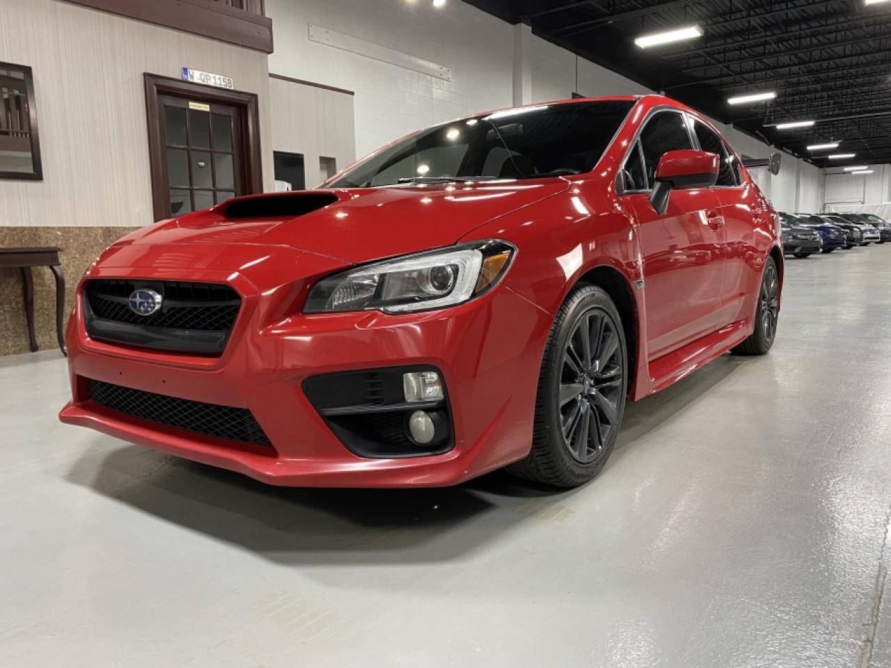 2015 Subaru WRX W/SPORT PKG / Premium Trim CLEAN CAR FAX, NO ACCEDENTS 268Hp/285ft lbs FAST Subarus Amazing ALL WHEEL DRIVE SYSTEM this vehicle is basically a street rally car . Rally Red Ext Black w/Red stitching interior AUTOMATIC Trans SI Drive System , Sunroof , Backup Camera and super carbon fiber rear spoiler. This vehicle is in immaculate condition driven under 15,000kms per year . This super clean Subaru WRX will not last long.<br>No accidents as per carfax.<br>Extended Warranty available<br>Accessories available at request. H.S.T. & licensing extra.<br>As per omvic regulations this vehicle is not certified and e-tested. Certification and 90 day powertrain warranty is available for $899.<br>FINANCING and LEASING options at preferred rates on O.A.C. on all vehicles.<br>Call us 905-760-1909<br>         <br>Please visit our new 20,000 sqft showroom, No haggle, No hassle in a care free environment with Espresso or Cappuccino by Lavazza on us!<br><br>