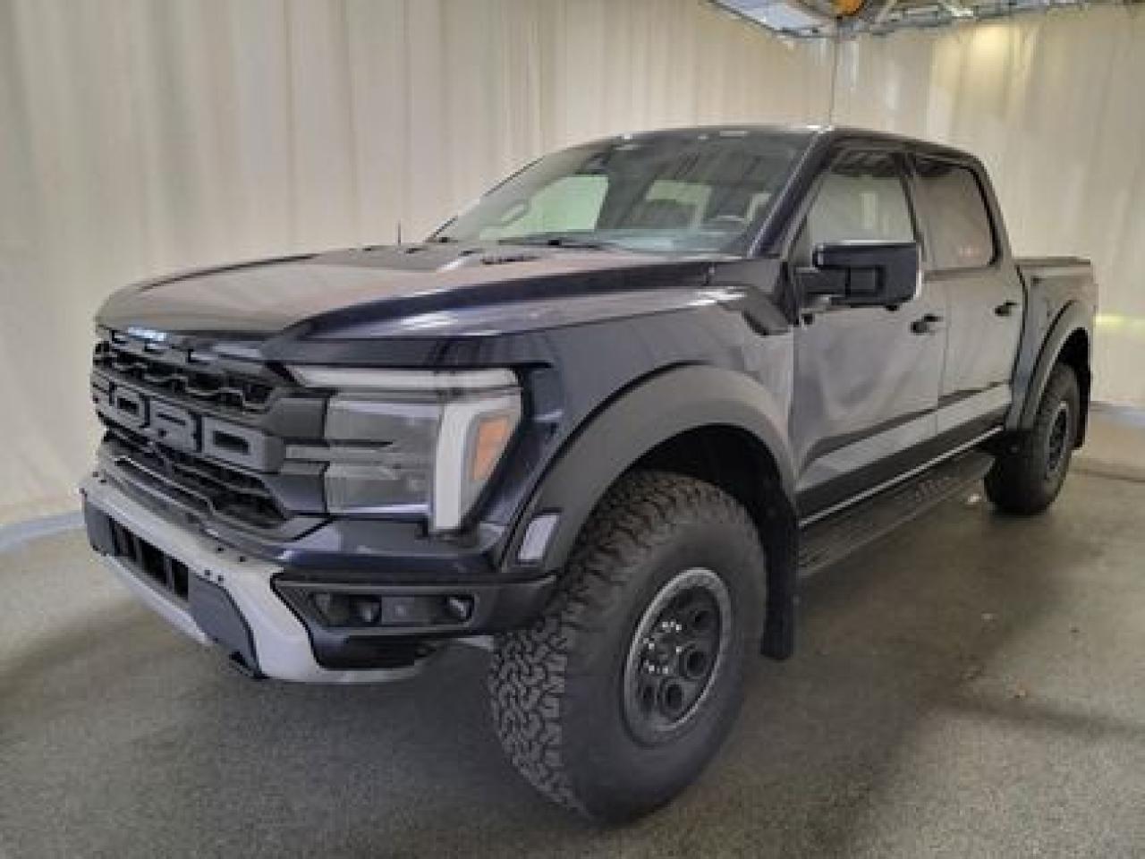 This all new, full sized 2024 Ford F-150 Raptor 802A 37 Raptor Package looks absolutely stunning in Antimatter Blue Metallic. This pick up comes with the 3.5L EcoBoost High Output engine. This remarkable engine not only produces 450 horsepower and 510 ft pounds of torque, but by leveraging the EcoBoost high output technology and a 10-speed automatic transmission. This truck can do 0-60 in a whopping 5.2 seconds!

Key Features:
37 Raptor Package
Carbon Fiber Interior 
17 Cast Aluminum Beadlock Wheels 
Dual Value Shocks 
Modular Front Bumper
Heated Seats 
Ventilated Front Seats 
Heated Steering Wheel 
Leather Shift Knob 
Remote Tailgate Release 
Remote Start System 
Adaptive Cruise Control 
Lane Centering 
Ford Co-Pilot 360 2.0
Lane Keep Assist 
Rear View Camera W/Hitch Assist 
Auto High Beams 
Reverse Sensing System 
360 Degree Camera 
B&O Unleashed Sound System 
Bed Utility Package 
Heads Up Display
Rain Sensing Wipers 
Mobile Office Package 
Pro Trailer Back Up Assist 
Wireless Charging Pad 
Universal Garage Door Opener 
Engine Block Heater
Twin Panel Moonroof

Saskatchewan has a challenging climate and driving conditions but let that stress melt away with the 2024 F-150 Raptor 37 Package, a tough truck that leverages physical features and technology that will keep your family safe. This specific unit is loaded right up and includes power windows, power locks, air conditioning,10-way power drivers seat, wrapped steering wheel, 4.10 Electronic Locking Axle, 400W Outlet, ambient lighting, cruise, outside temperature display, hill start assist, perimeter safety system, four-wheel drive, and so much more. 

Bennett Dunlop Ford has been located at 770 Broad St, in the heart of Regina for over 40 years! Our 4.6 Star google review (Well over 1,800 reviews) is the result of our commitment to providing the fastest, easiest and most fun customer experience possible. Our customers tell us that they love that we dont charge any admin or documentation fees, our sales team will simply offer our best price upfront and we have a no-questions-asked money back guarantee just in case you change your mind after your purchase.