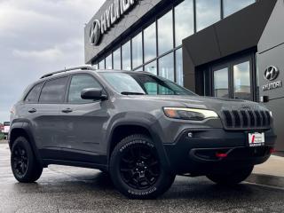 <b>Low Mileage, Off-Road Suspension,  Apple CarPlay,  Android Auto,  Heated Mirrors!</b><br> <br>  Compare at $27707 - Our Price is just $26900! <br> <br>   This 2019 Jeep Cherokee can deliver plenty of off-roading capability, but the bigger story is that its civilized and comfortable enough to drive to work every day. This  2019 Jeep Cherokee is fresh on our lot in Midland. <br> <br>When the freedom to explore arrives alongside exceptional value, the world opens up to offer endless opportunities. This is what you can expect with this Jeep Cherokee. With an exceptionally smooth ride and an award-winning interior, this Cherokee can take you anywhere in comfort and style. Redesigned for 2019, this Jeep has a refined new look without sacrificing its rugged presence. Experience adventure and discover new territories with the unique and authentically crafted Jeep Cherokee, a major player in Canadas best-selling SUV brand. This low mileage  SUV has just 51,273 kms. Its  sting-gray clearcoat in colour  . It has an automatic transmission and is powered by a  271HP 3.2L V6 Cylinder Engine.  It may have some remaining factory warranty, please check with dealer for details. <br> <br> Our Cherokees trim level is Trailhawk. Travel in style with this off-road-ready Jeep Cherokee Trailhawk. It comes loaded with heated leather seats with red stitching, driver memory settings, a heated steering wheel, unique black aluminum wheels, 4-wheel drive, an off-road suspension, skid plates, hands free liftgate, Uconnect 8.4 with Bluetooth, a rearview camera and much more. This vehicle has been upgraded with the following features: Off-road Suspension,  Apple Carplay,  Android Auto,  Heated Mirrors. <br> To view the original window sticker for this vehicle view this <a href=http://www.chrysler.com/hostd/windowsticker/getWindowStickerPdf.do?vin=1C4PJMBX5KD447187 target=_blank>http://www.chrysler.com/hostd/windowsticker/getWindowStickerPdf.do?vin=1C4PJMBX5KD447187</a>. <br/><br> <br>To apply right now for financing use this link : <a href=https://www.bourgeoishyundai.com/finance/ target=_blank>https://www.bourgeoishyundai.com/finance/</a><br><br> <br/><br>BUY WITH CONFIDENCE. Bourgeois Auto Group, we dont just sell cars; for over 75 years, we have delivered extraordinary automotive experiences in every showroom, on the road, and at your home. Offering complimentary delivery in an enclosed trailer. <br><br>Why buy from the Bourgeois Auto Group? Whether you are looking for a great place to buy your next new or used vehicle find a qualified repair center or looking for parts for your vehicle the Bourgeois Auto Group has the answer. We offer both new vehicles and pre-owned vehicles with over 25 brand manufacturers and over 200 Pre-owned Vehicles to choose from. Were constantly changing to meet the needs of our customers and stay ahead of the competition, and we are committed to investing in modern technology to ensure that we are always on the cutting edge. We use very strategic programs and tools that give us current market data to price our vehicles to the market to make sure that our customers are getting the best deal not only on the new car but on your trade-in as well. Ask for your free Live Market analysis report and save time and money. <br><br>WE BUY CARS  Any make model or condition, No purchase necessary. We are OPEN 24 hours a Day/7 Days a week with our online showroom and chat service. Our market value pricing provides the most competitive prices on all our pre-owned vehicles all the time. Market Value Pricing is achieved by polling over 20000 pre-owned websites every day to ensure that every single customer receives real-time Market Value Pricing on every pre-owned vehicle we sell. Customer service is our top priority. No hidden costs or fees, and full disclosure on all services and Carfax®. <br><br>With over 23 brands and over 400 full- and part-time employees, we look forward to serving all your automotive needs! <br> Come by and check out our fleet of 30+ used cars and trucks and 60+ new cars and trucks for sale in Midland.  o~o