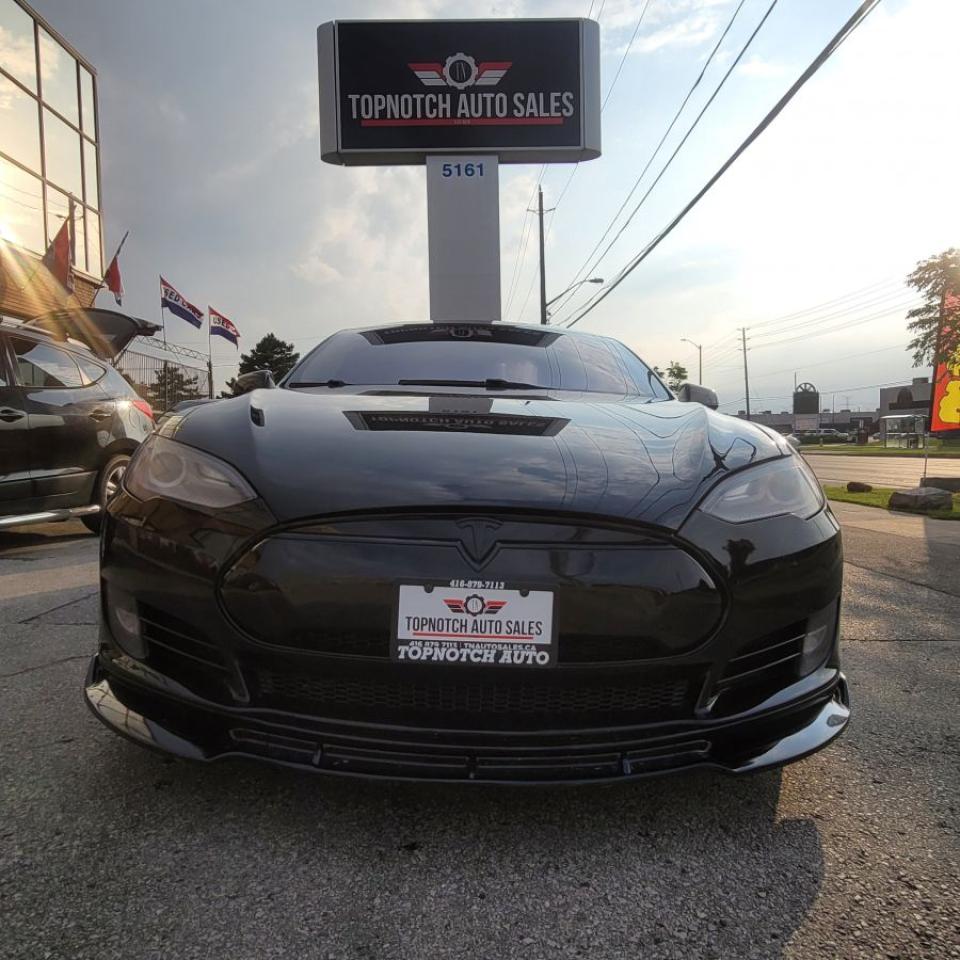 .FREE SUPER CHARGING FOR LIFE<br>. 21 inch all seasons full chrome delete blacked <br><br>**** REBIULT TITLE *****<br><br>                              !!!!!THIS VEHICLE COMES CERTIFIED IN THE ADVERTISED PRICE!!!!<br><br>Topnotch Auto Sale is a well established dealer, being in business for well over 14 years. We pride ourselves on how we maintain relationships with our clients, making customer service our first priority. We always aim to keep our large indoor showroom stocked with a diverse inventory, containing the right car for any type of customer. If financing is needed, we provide on the spot financing on all makes and vehicle models. We welcome you to give us a call, take a look online, or come to our establishment. Looking forward to seeing you !<br><br><br><br>Please Note: HST and Licensing is an additional fee separate from the advertised price. <br><br>We have a strong confidence in our cars, if you want to have a car inspected, TopNotch Auto Sales welcomes it.