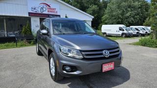 2014 VOLKSWAGEN TIGUAN 4MOTION Trendline featuring Cruise Control, Hand free phone, Air Conditioning, Tilt/Telescoping Steering Column,  Alloy Wheels, Fixed Rear Window w/Fixed Interval Wiper and Defroster,  Galvanized Steel Panels, Chrome grille,  Keyless Entry, Power Windows, Electric Power-Assist Speed-Sensing Steering and more.<br><br>Purchase price: $13,788  plus HST and LICENSING<br><br>Safety package is available for $799 and includes Ontario Certification, 3 month or 3000 km Lubrico warranty ($1000 per claim) and oil change.<br>If not certified, by OMVIC regulations this vehicle is being sold AS-lS and is not represented as being in road worthy condition, mechanically sound or maintained at any guaranteed level of quality. The vehicle may not be fit for use as a means of transportation and may require substantial repairs at the purchaser   s expense. It may not be possible to register the vehicle to be driven in its current condition.<br><br>CARFAX PROVIDED FOR EVERY VEHICLE<br><br>WARRANTY: Extended warranty with variety terms and coverages is available, please ask our representative for more details.<br>FINANCING: Regardless of your credit score, we are committed to assisting you in obtaining a customized car loan that suits your specific circumstances. Our goal is to help you enhance your credit score significantly by the time you complete your loan term. Our specialists are happy to assist you with all necessary information.<br>TRADE-IN OR SELL: Upgrade your ride by trading-in your vehicle and save on taxes, or Sell it to us, and get the best value for your current vehicle.<br><br>Smart Wheels Used Car Dealership     OMVIC Registered Dealer<br>642 Dunlop St West, Barrie, ON L4N 9M5<br>Phone: 705-721-1341 ext 201<br>Email: Info@swcarsales.ca<br>Web: www.swcarsales.ca<br>Terms and conditions may apply. Price and availability subject to change. Contact us for the latest information<br>